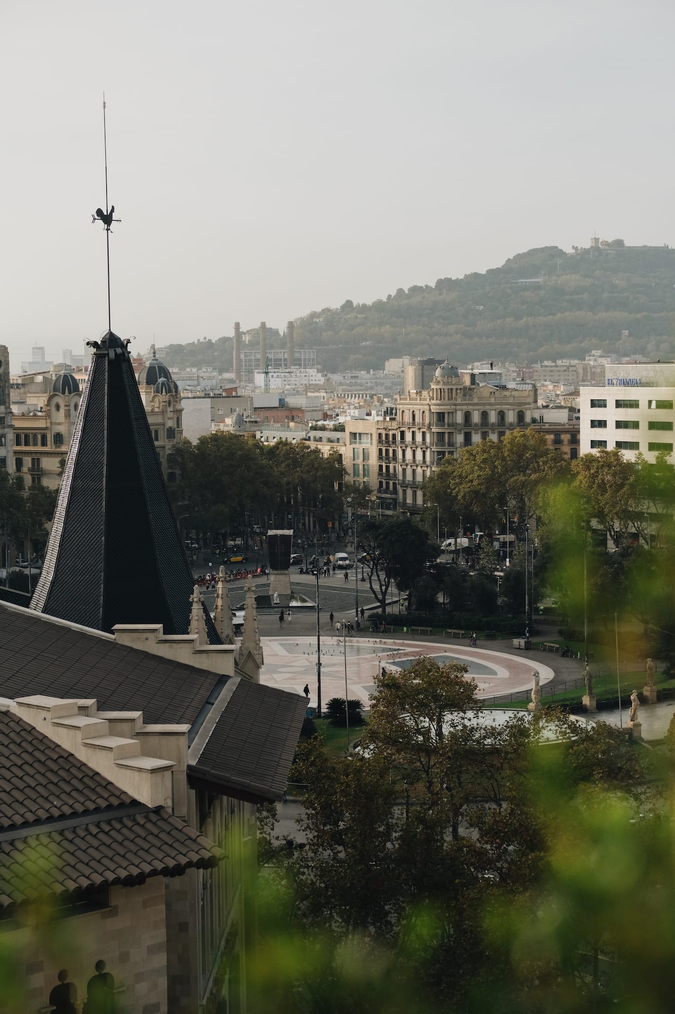 a city with a spire and trees