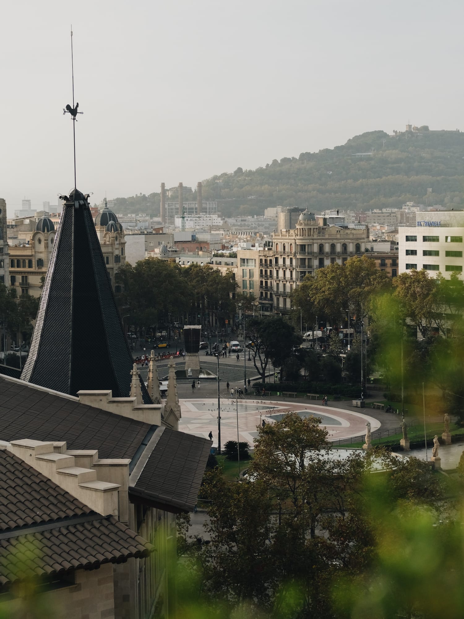 a city with a spire and trees