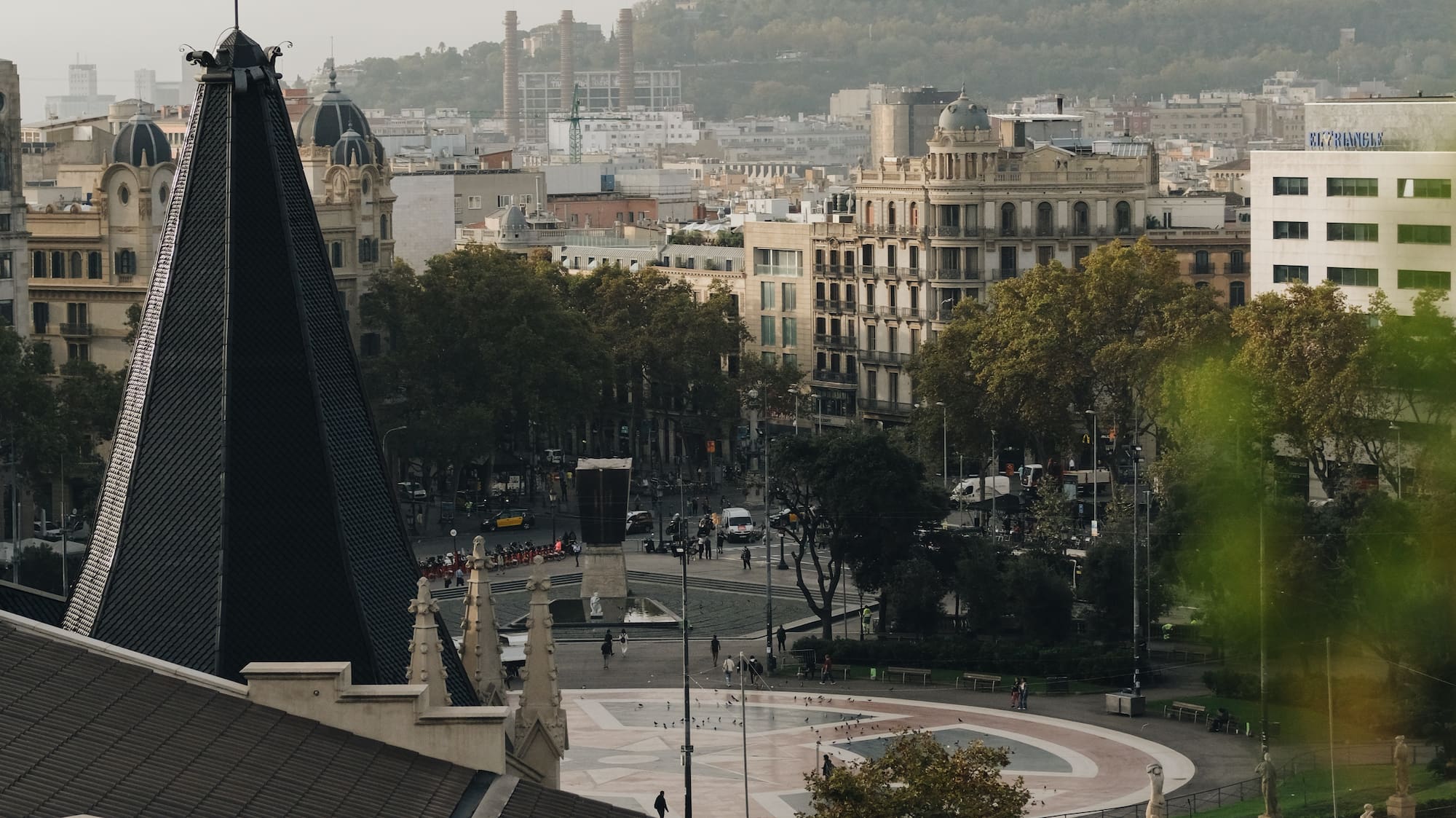 a city with a spire and trees