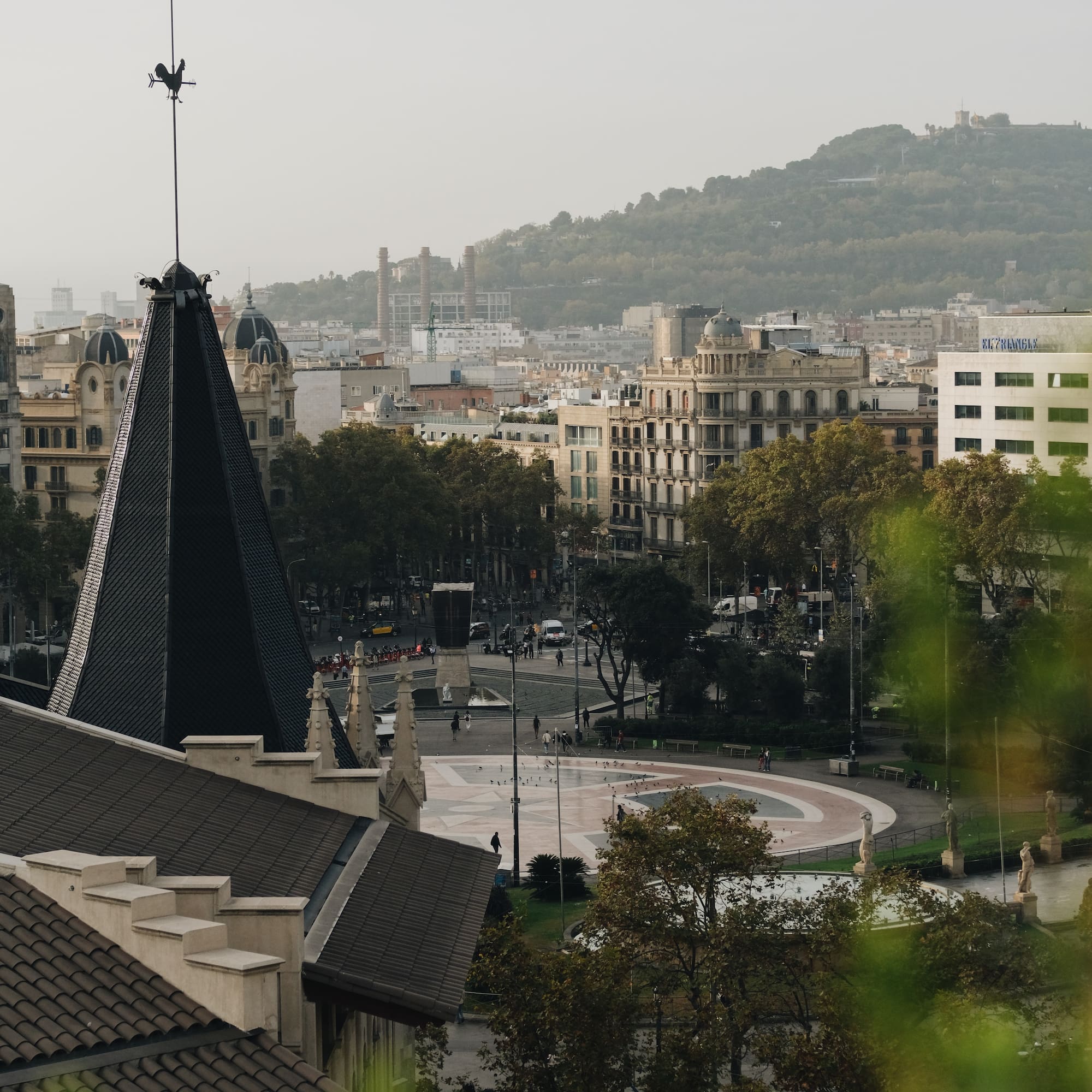 a city with a spire and trees