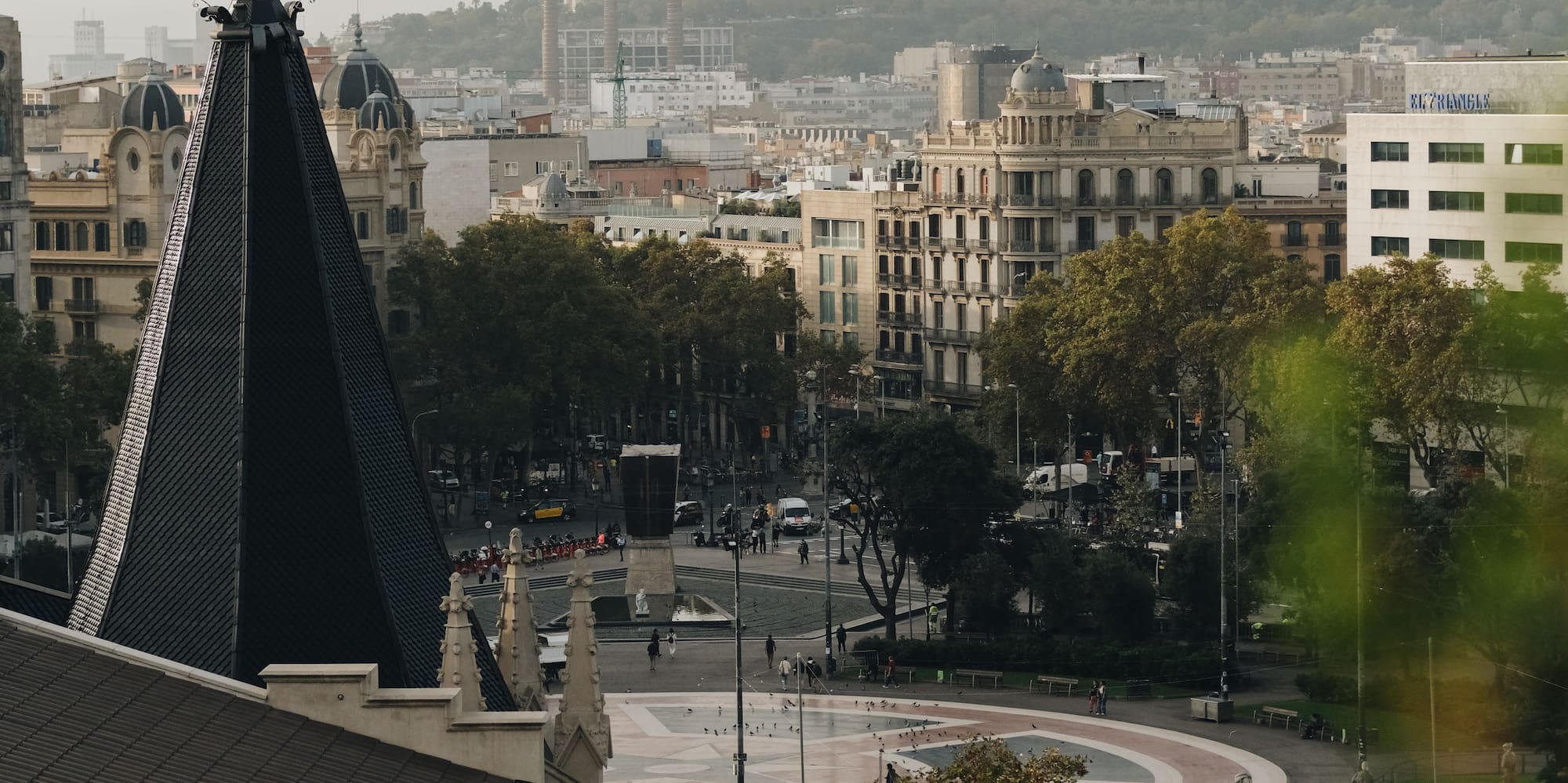 a city with a spire and trees