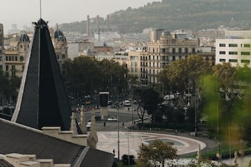 a city with a spire and trees