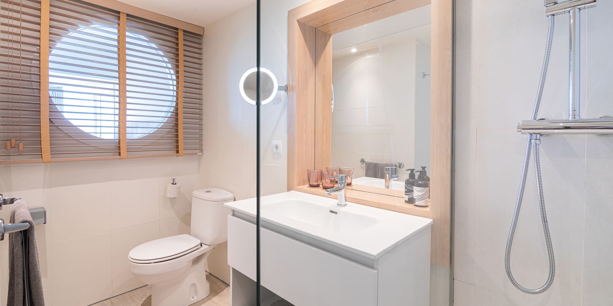 a bathroom with a sink toilet and mirror