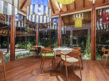 a room with a table and chairs