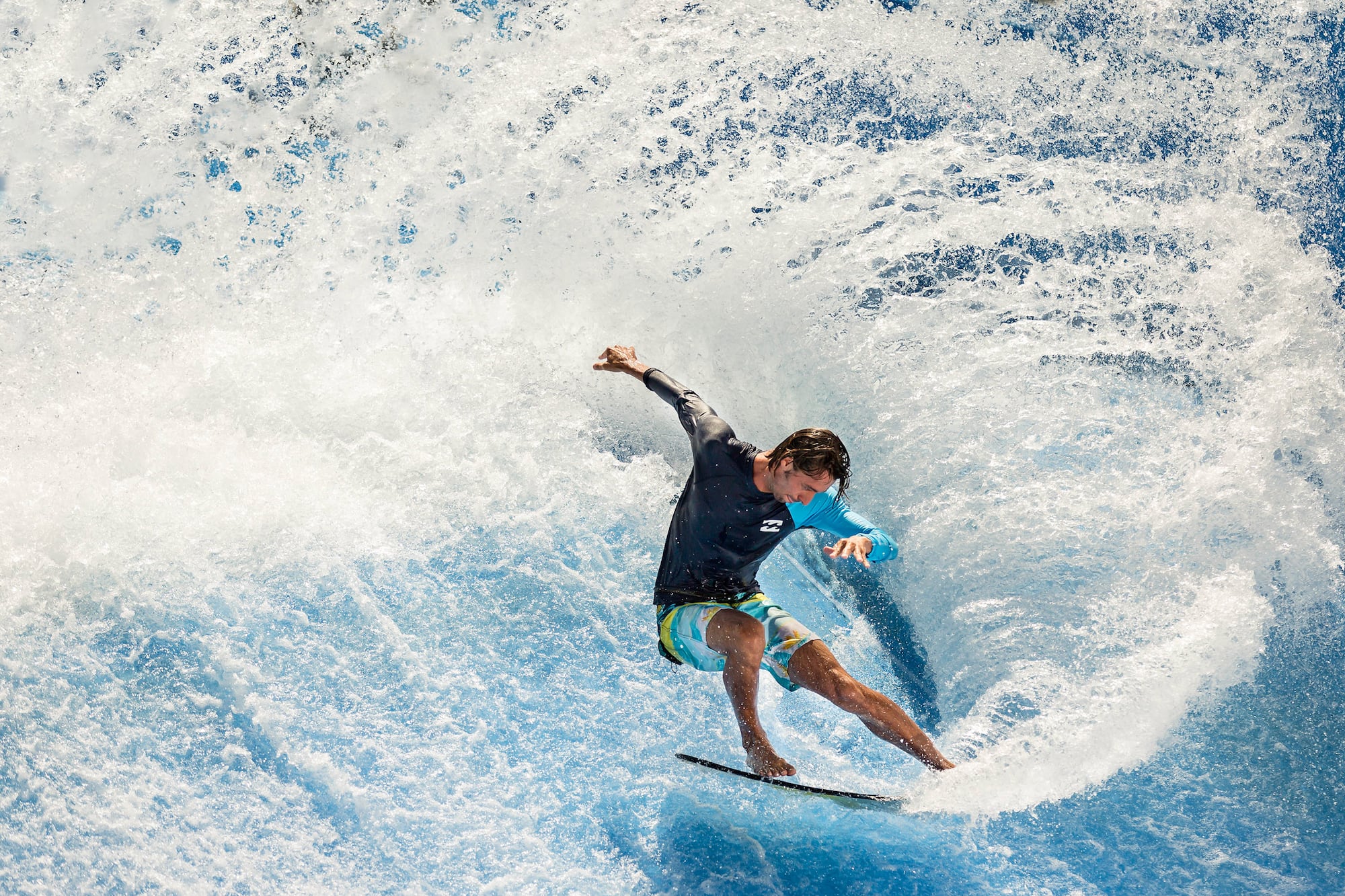a man surfing on a wave