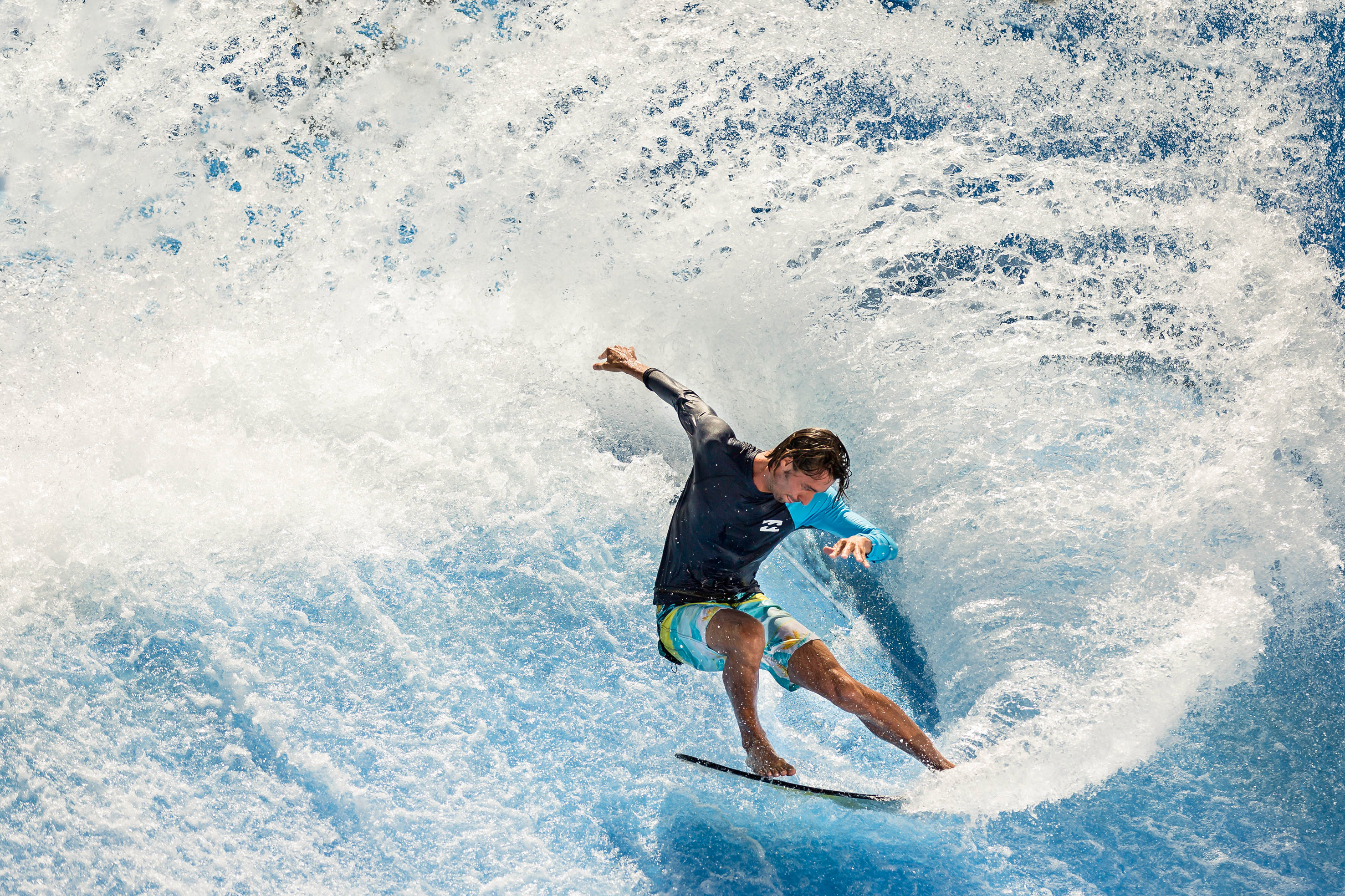 a man surfing on a wave