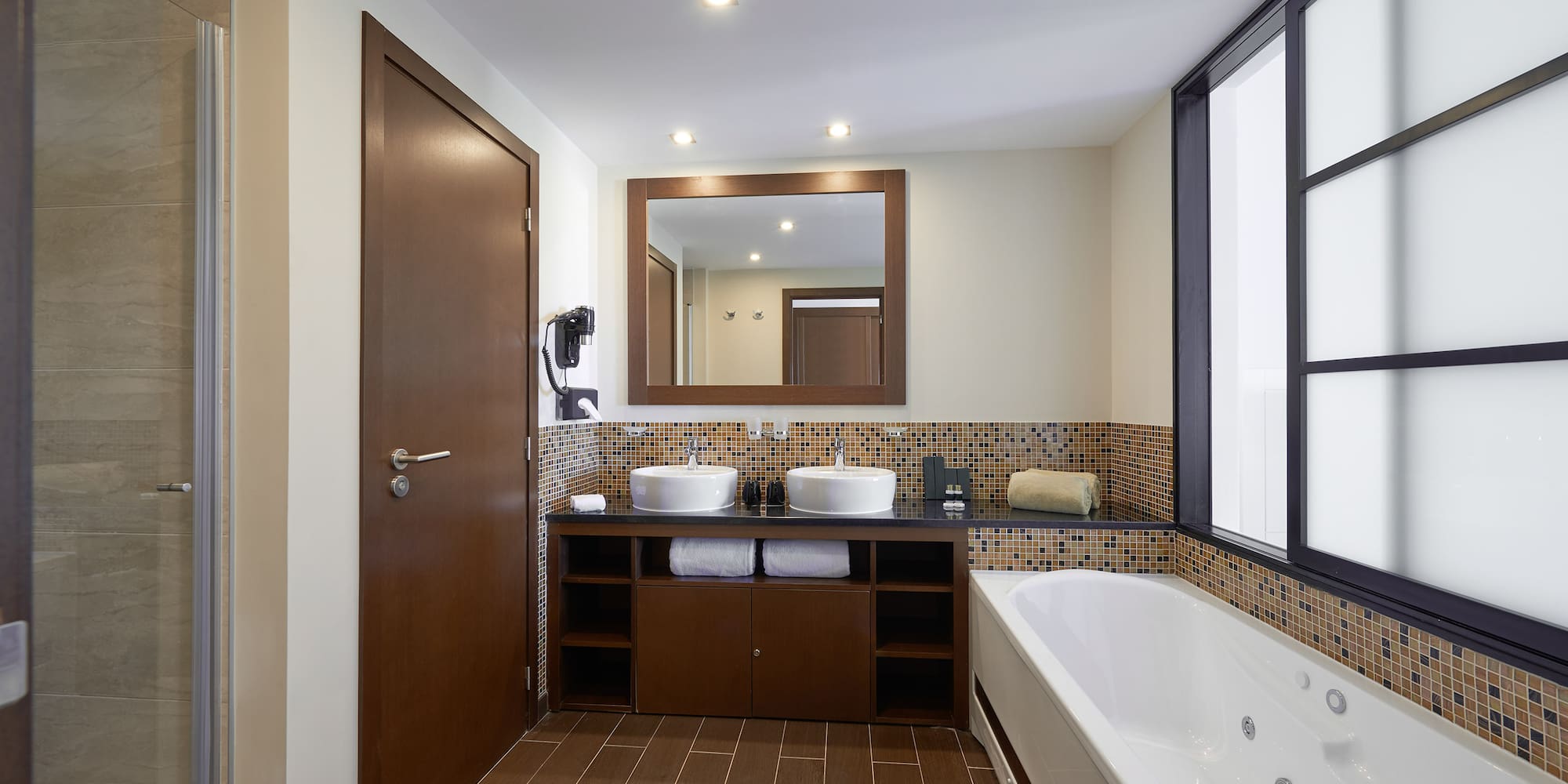 a bathroom with a bathtub and sink