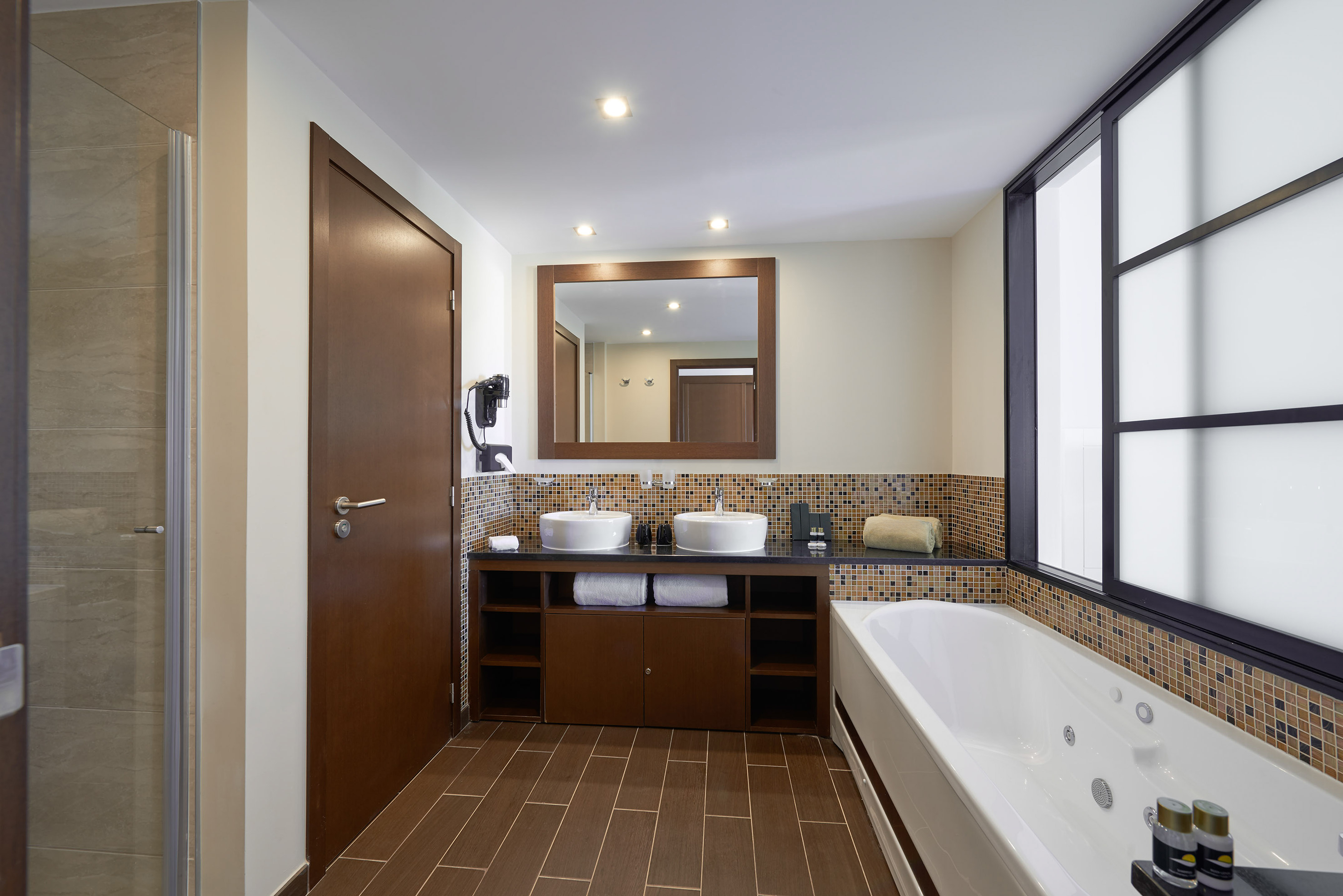 a bathroom with a bathtub and sink