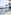Tropical ocean view infinity pool, luxury resort with palm trees and terrace.