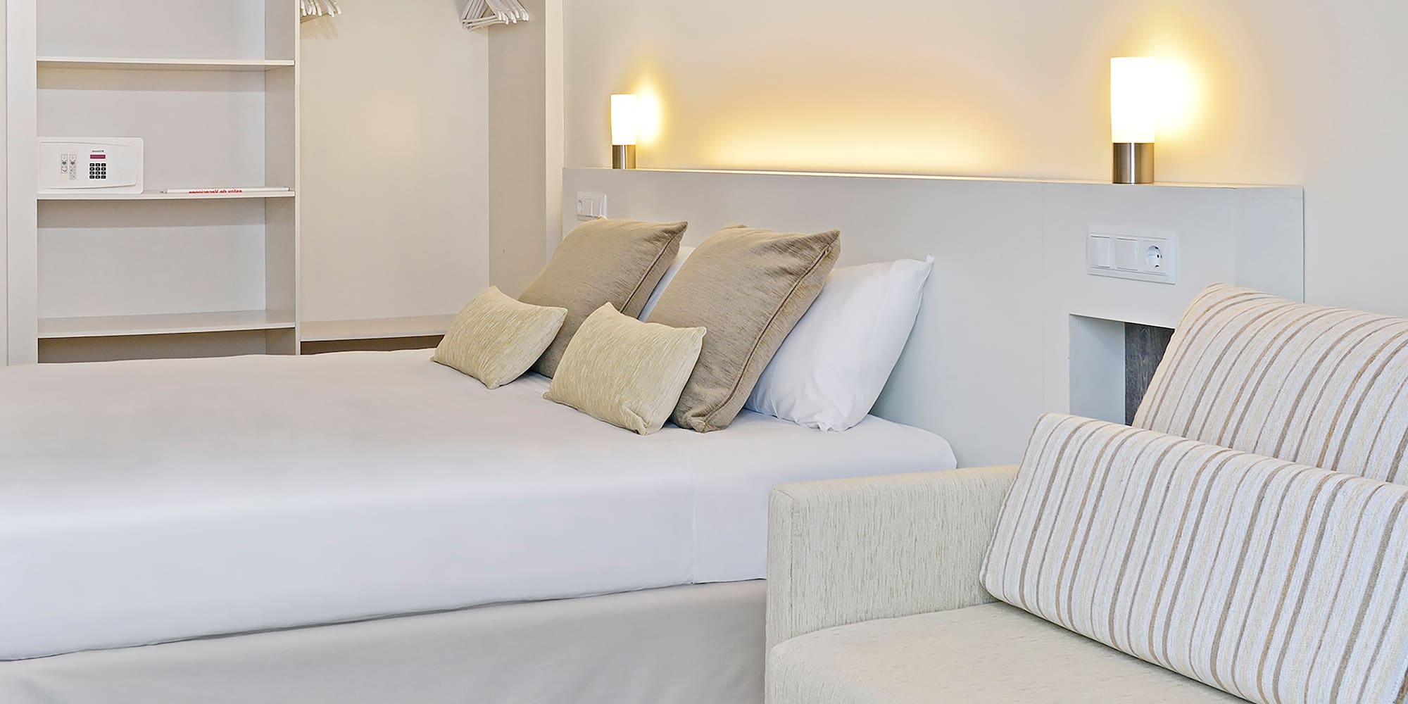 a bed and couch in a room