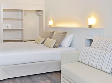 a bed and couch in a room