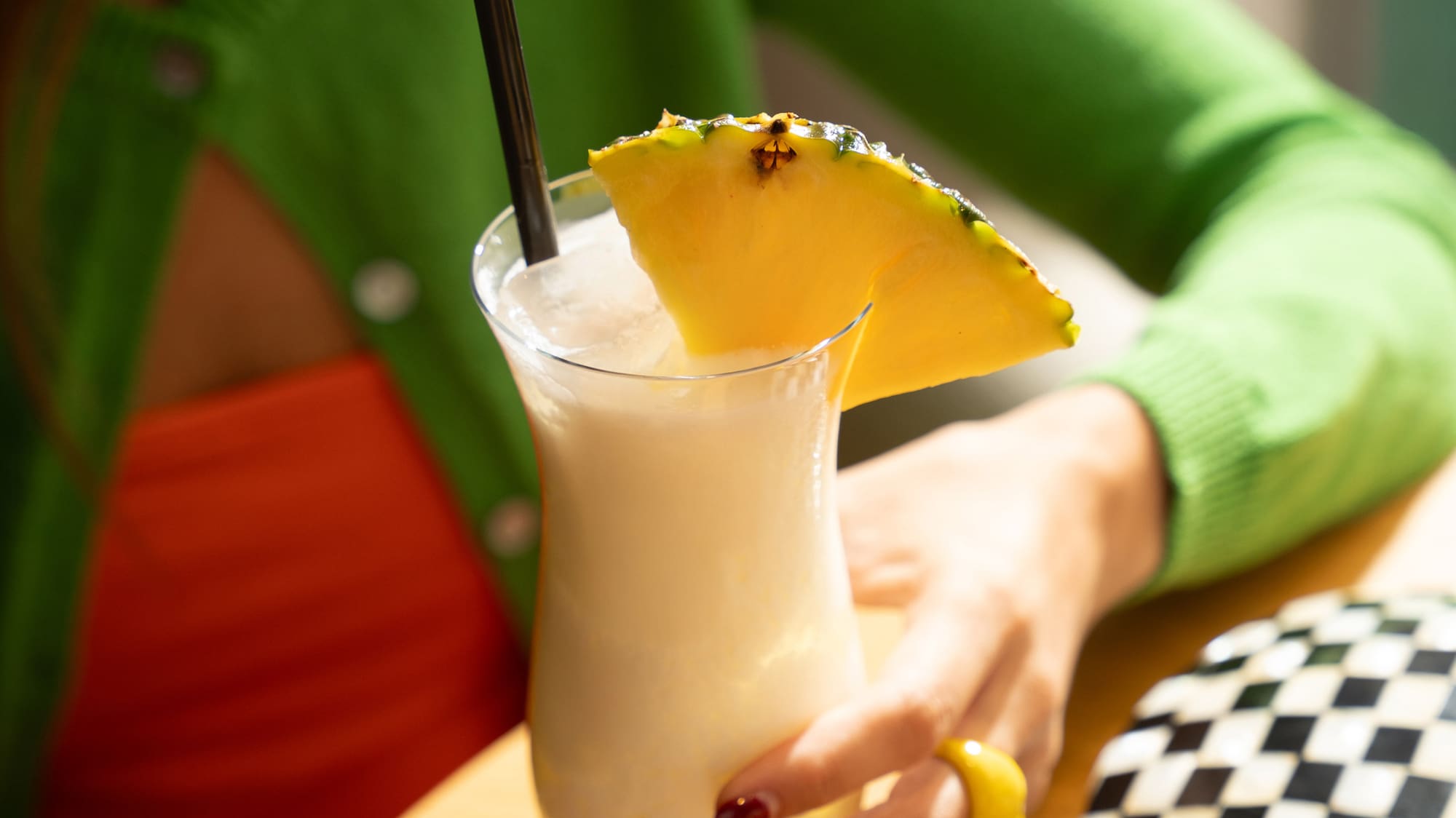 a woman holding a drink