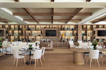 a room with a tv and tables