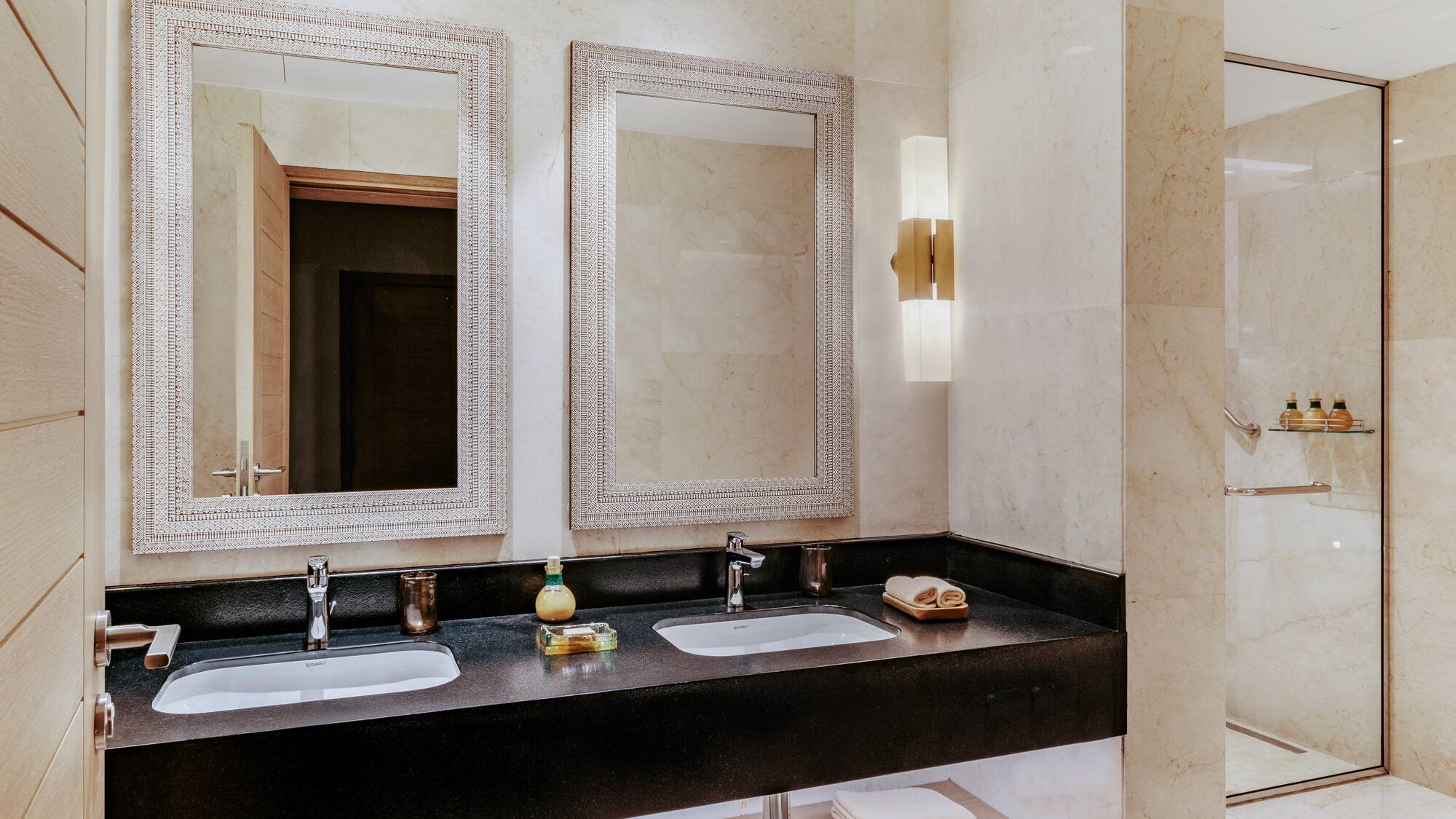 a bathroom with two sinks and mirrors