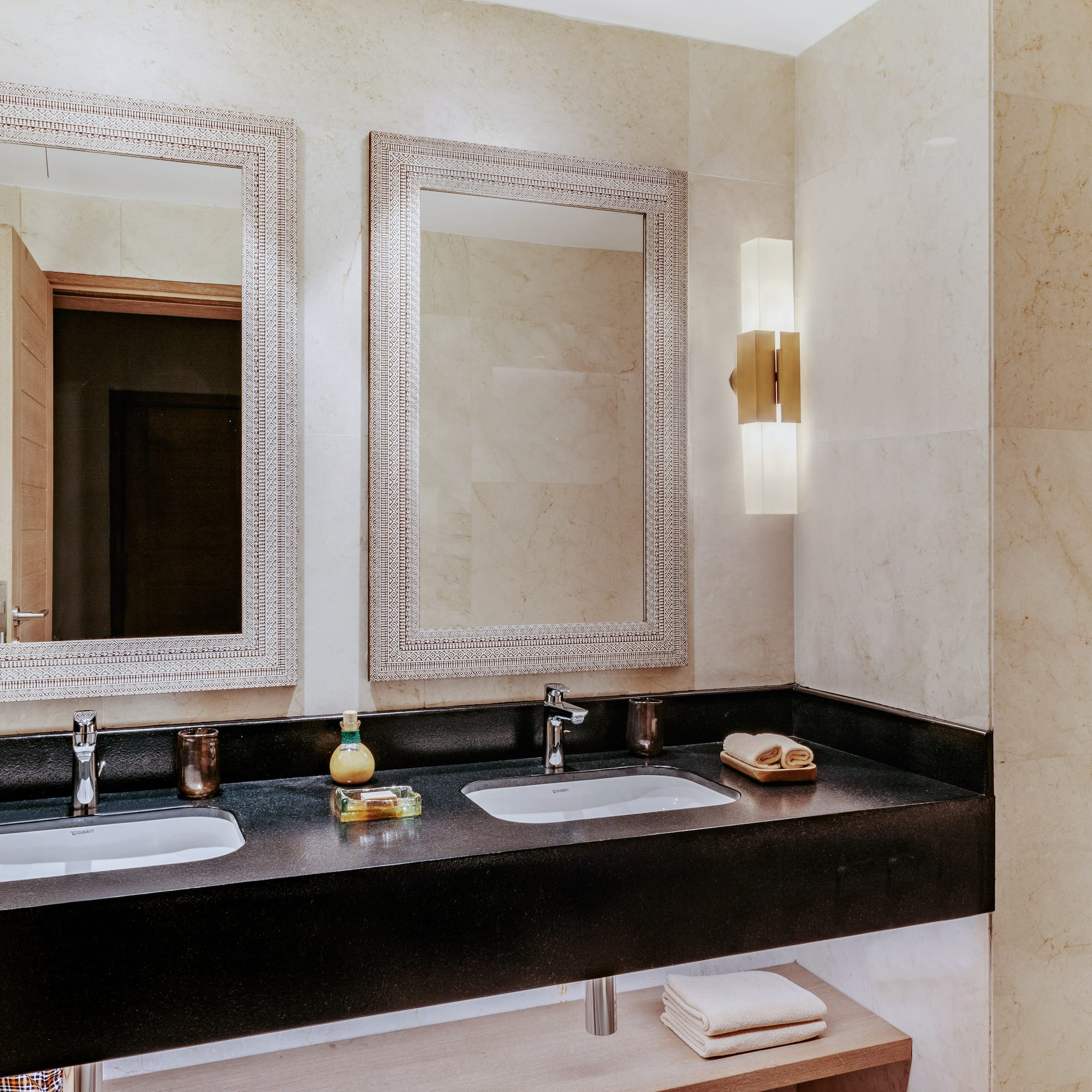 a bathroom with two sinks and mirrors