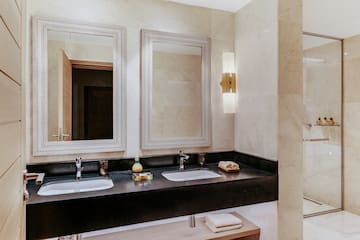 a bathroom with two sinks and mirrors