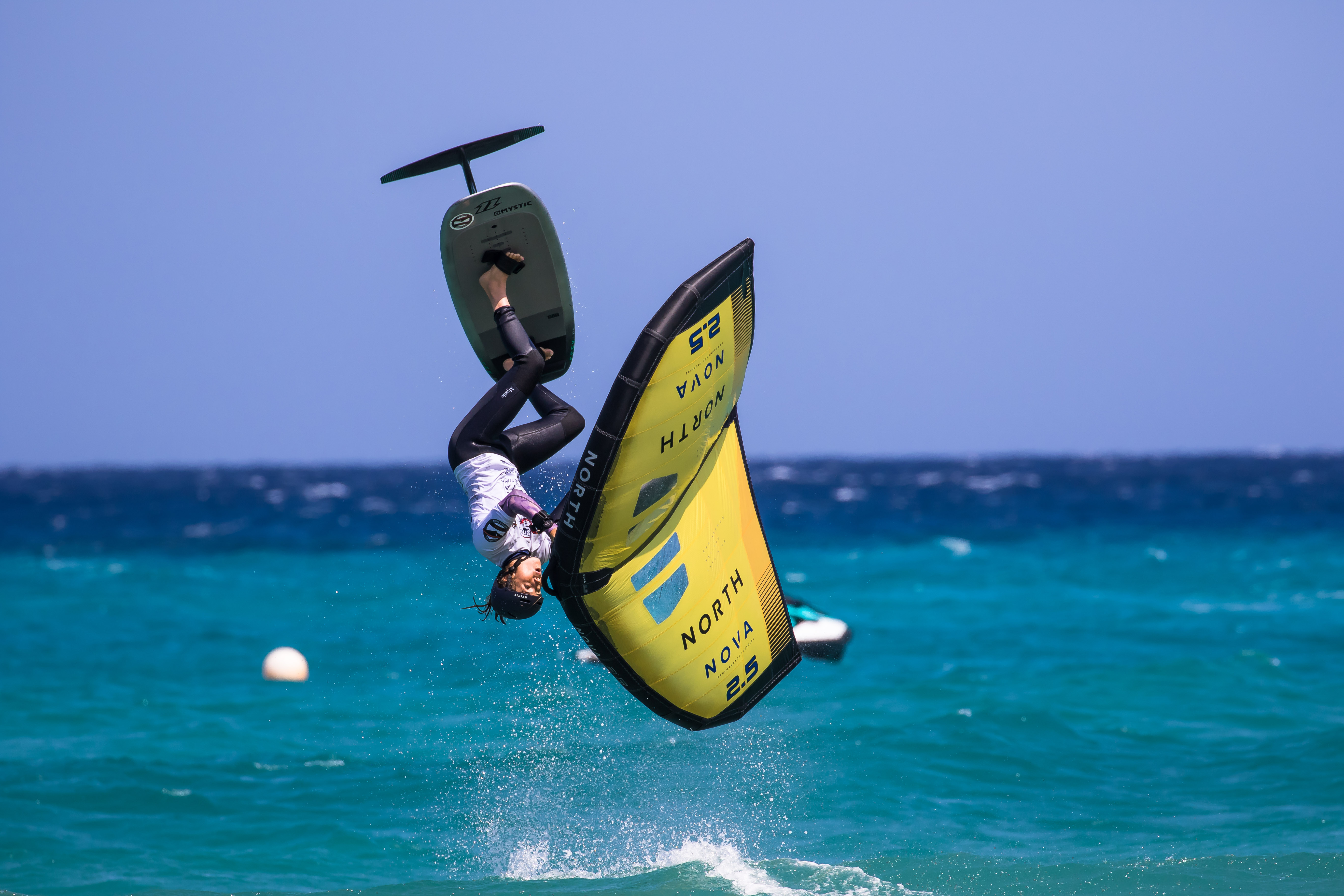 a person doing a flip on a surfboard