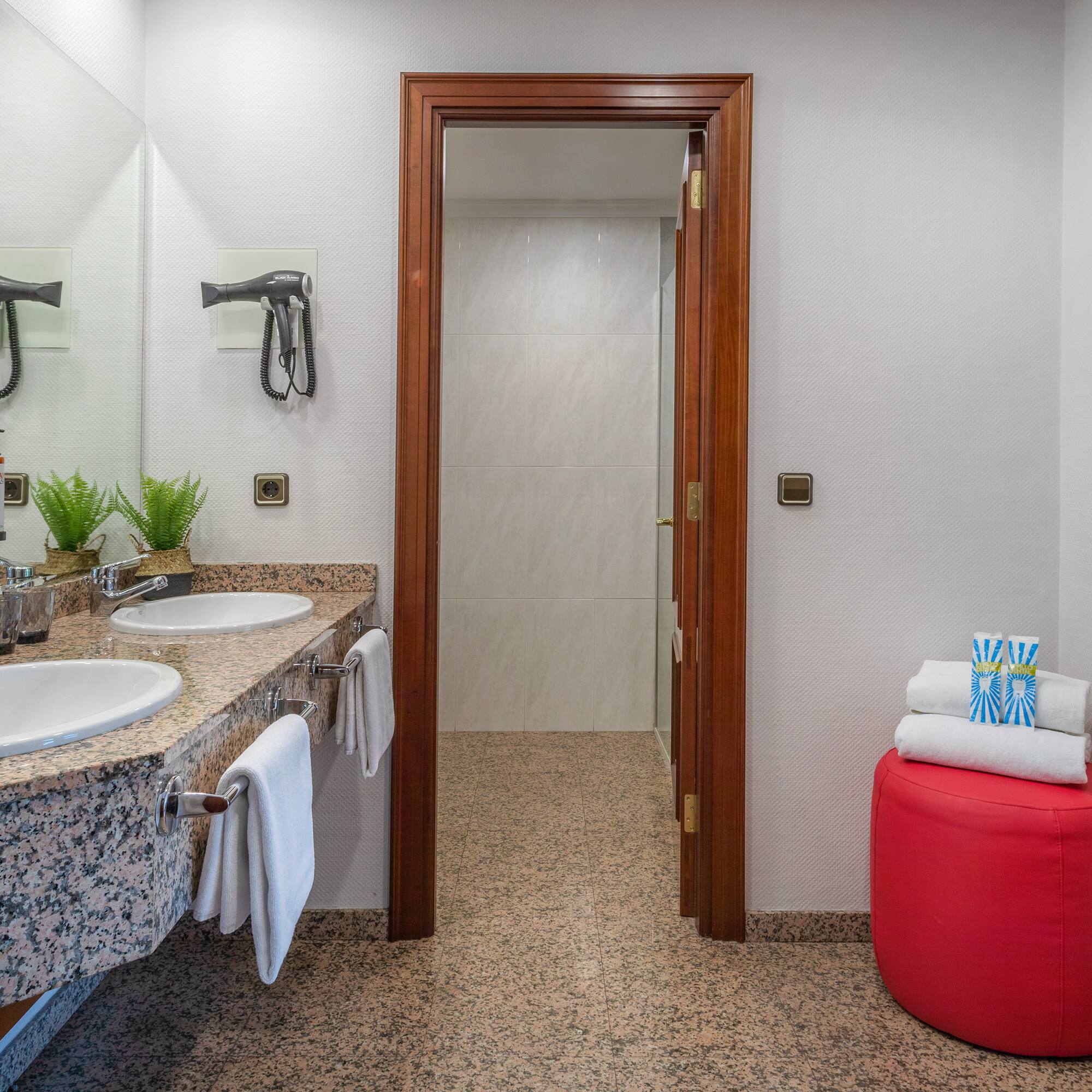 a bathroom with marble countertops and sinks