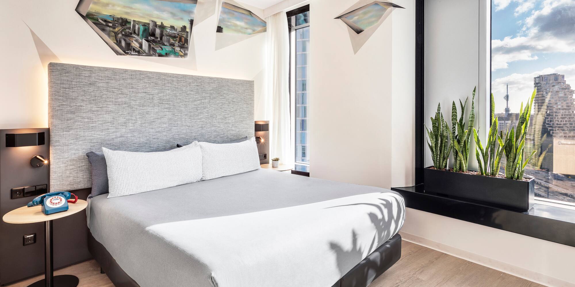 a bed with a plant in a pot