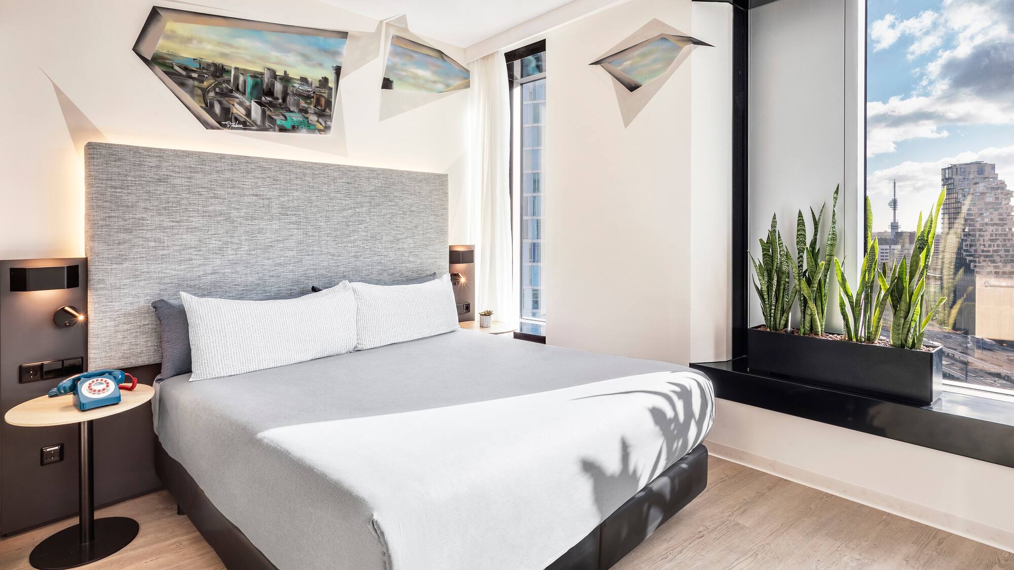 a bed with a plant in a pot