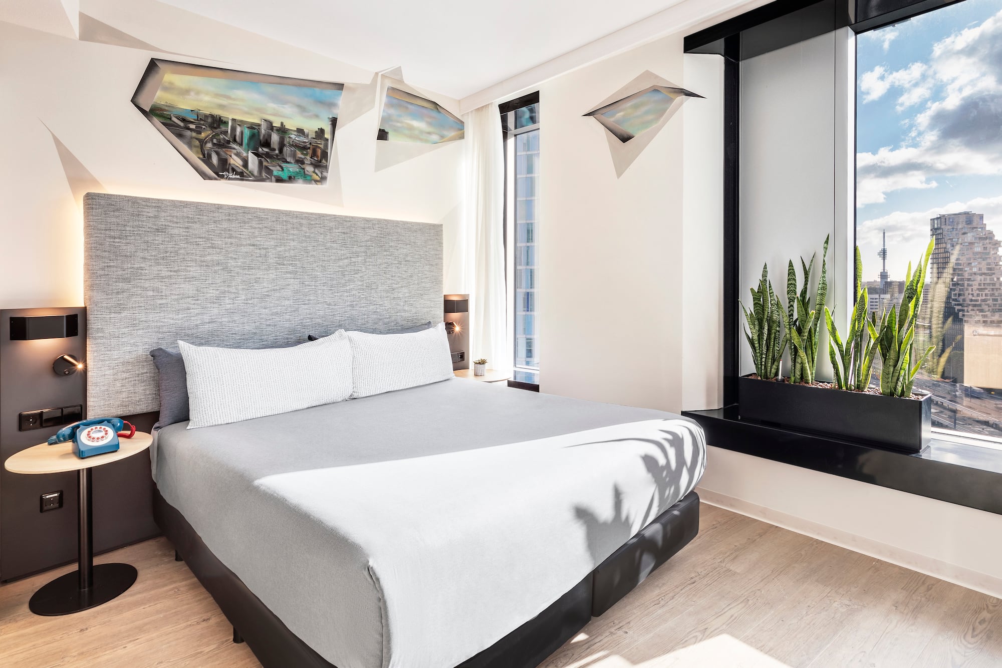 a bed with a plant in a pot