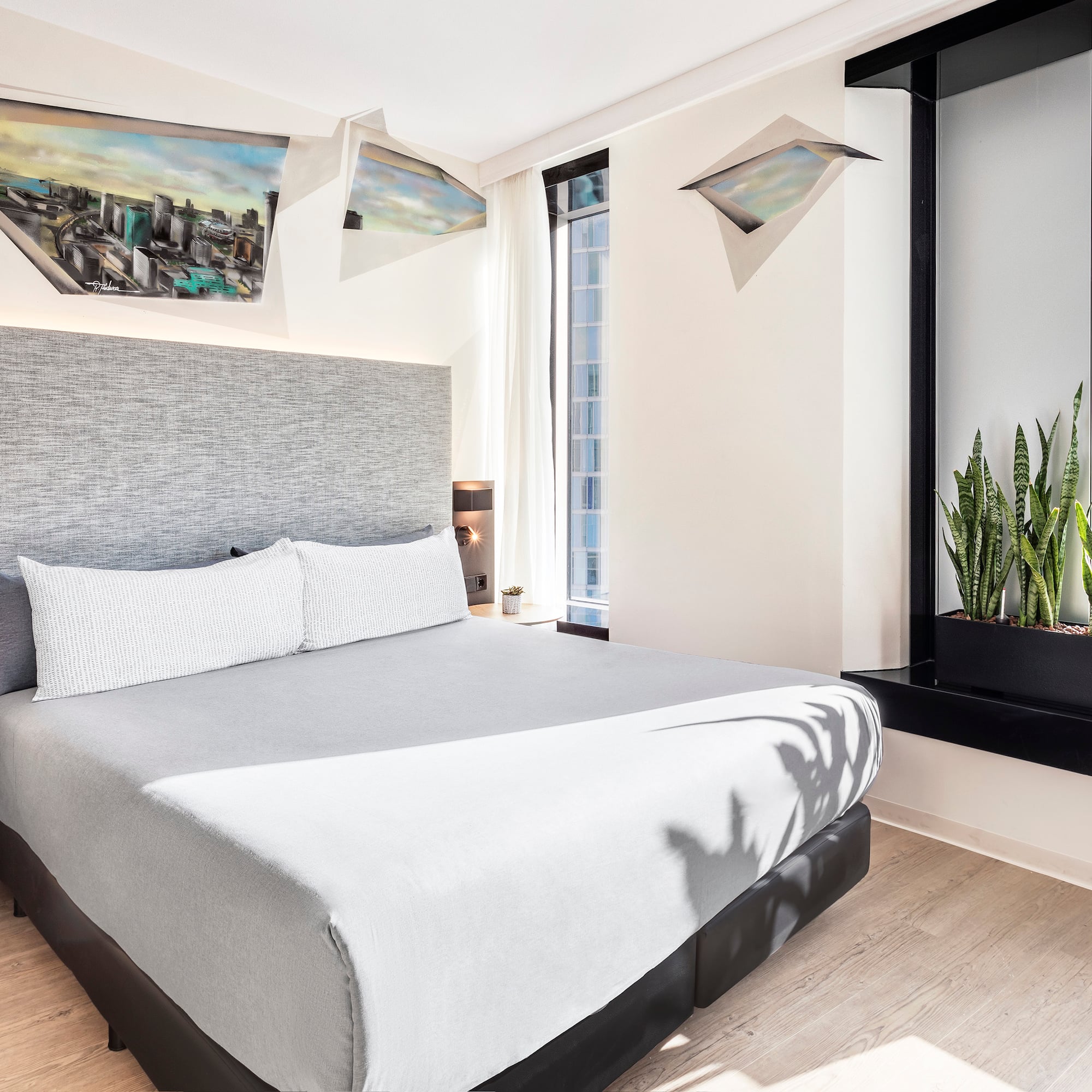 a bed with a plant in a pot