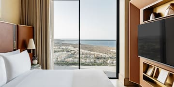 a room with a large window overlooking a city