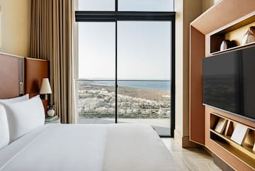 a room with a large window overlooking a city