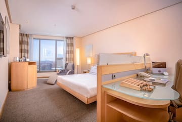 a room with a bed and a desk