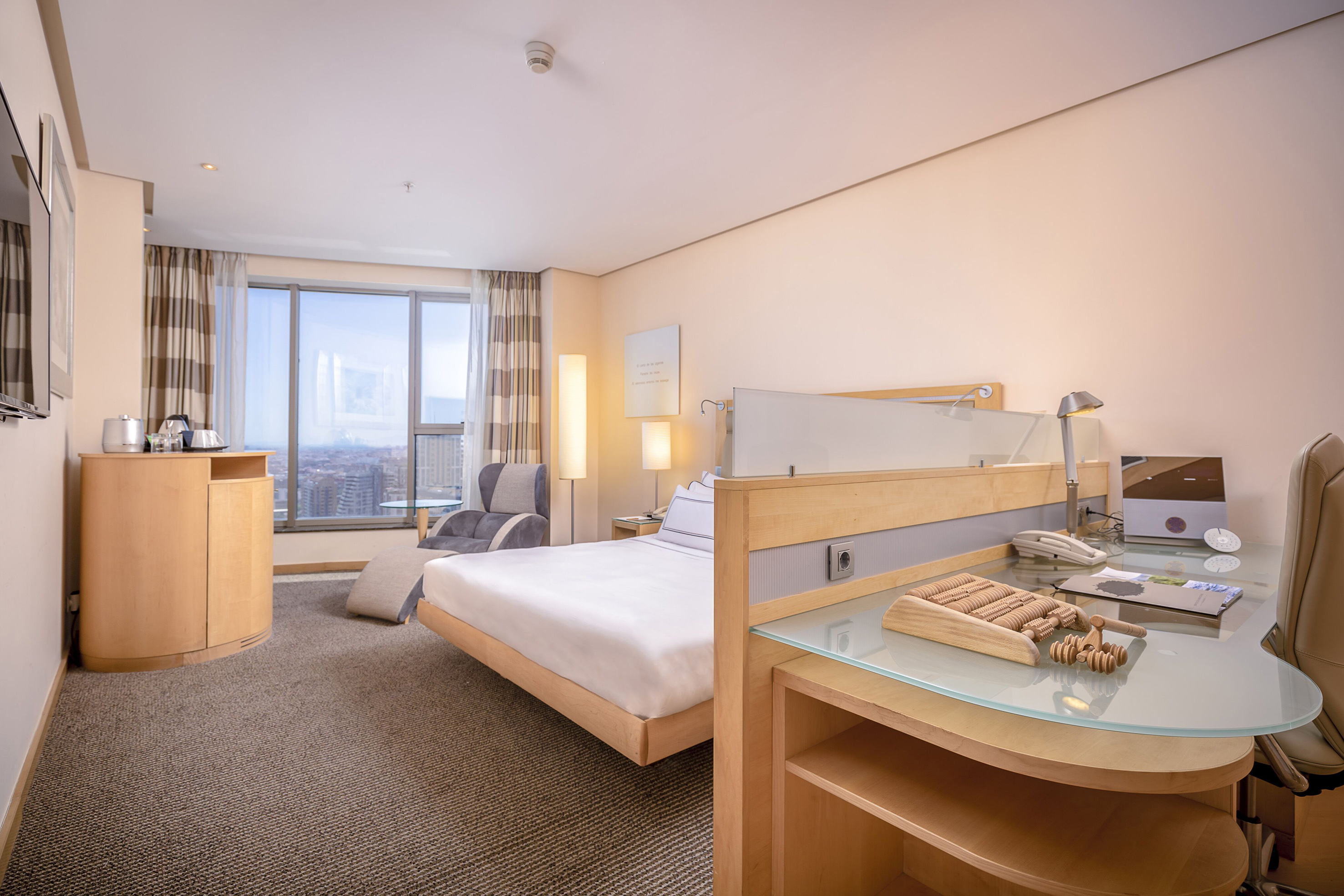 a room with a bed and a desk