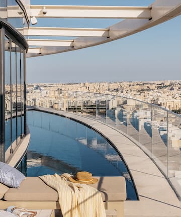 a pool with a view of a city