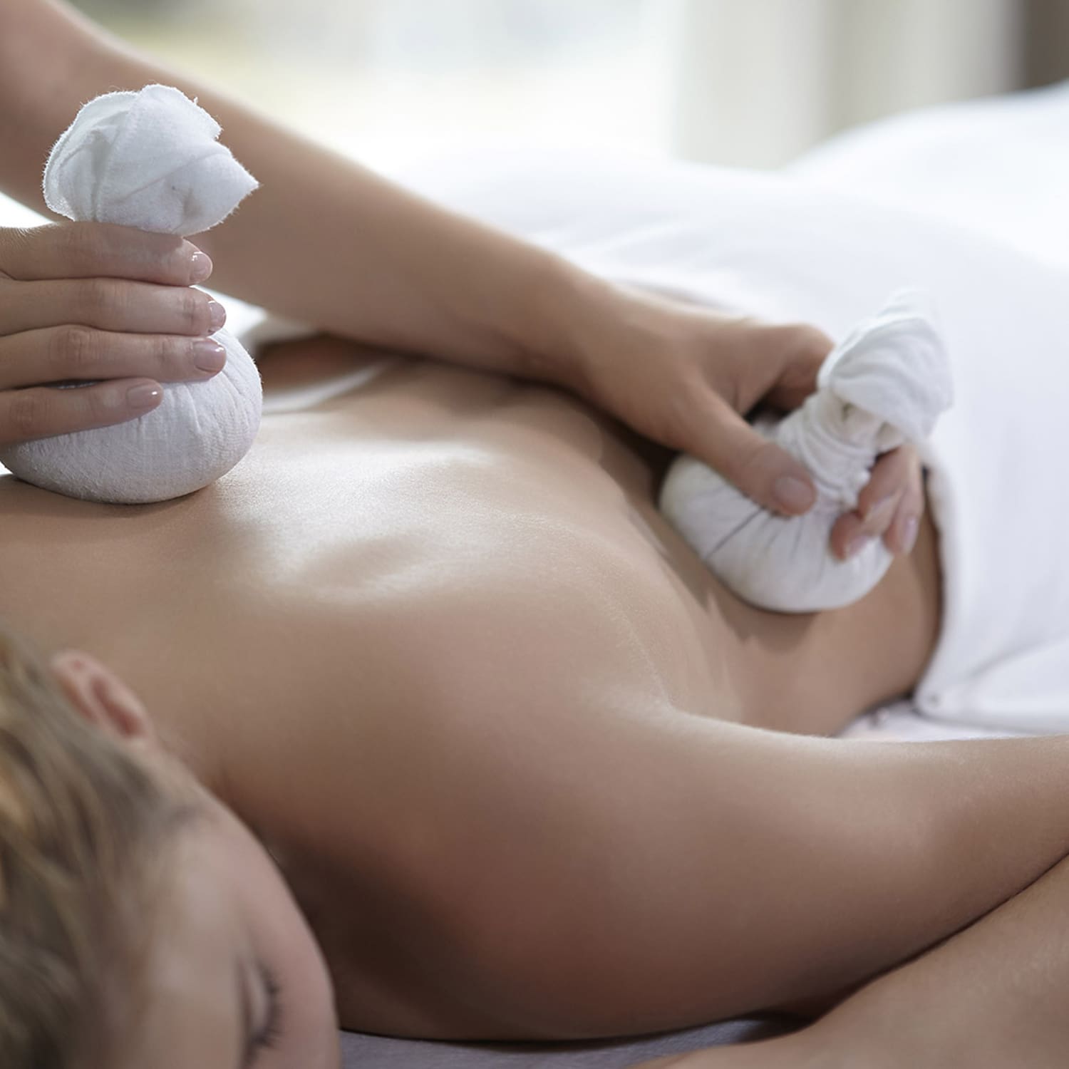 a woman receiving a back massage