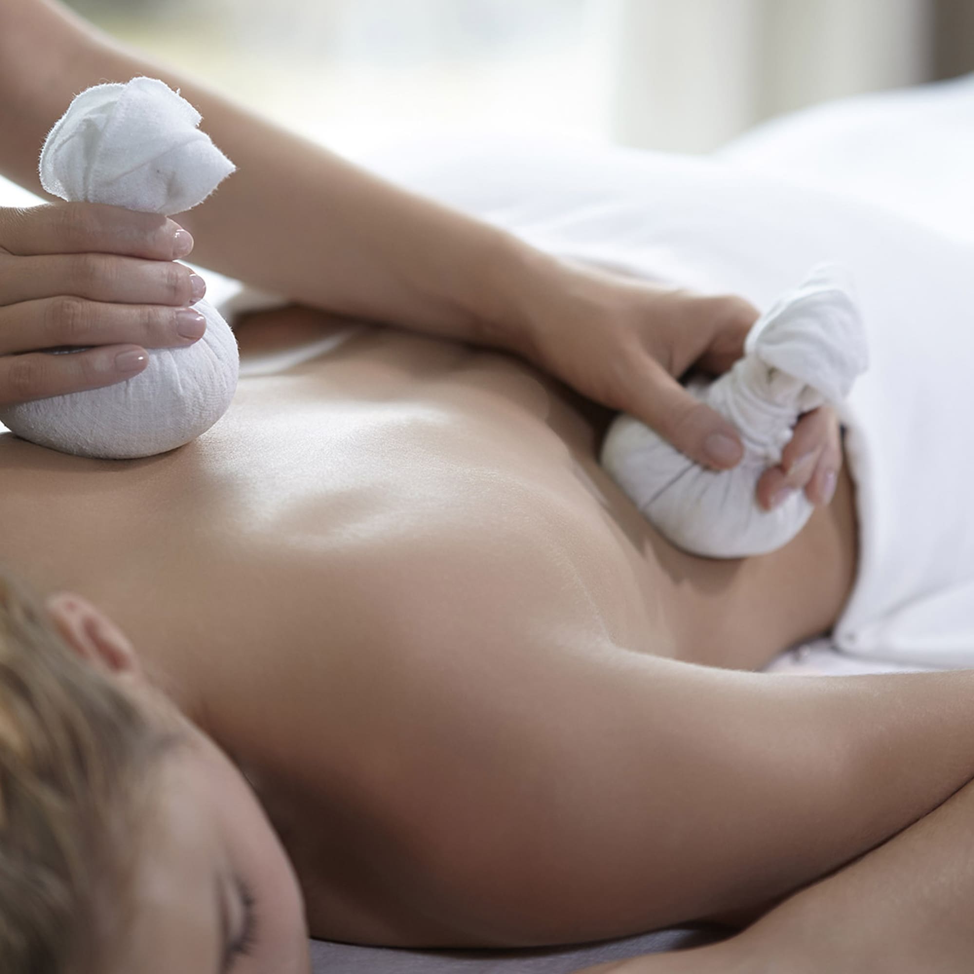 a woman receiving a back massage