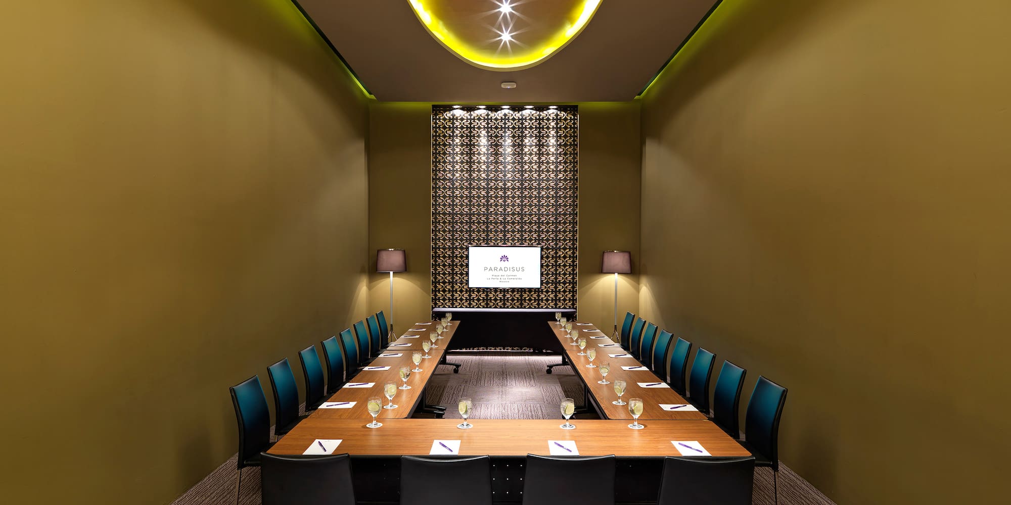 a room with a long table and chairs