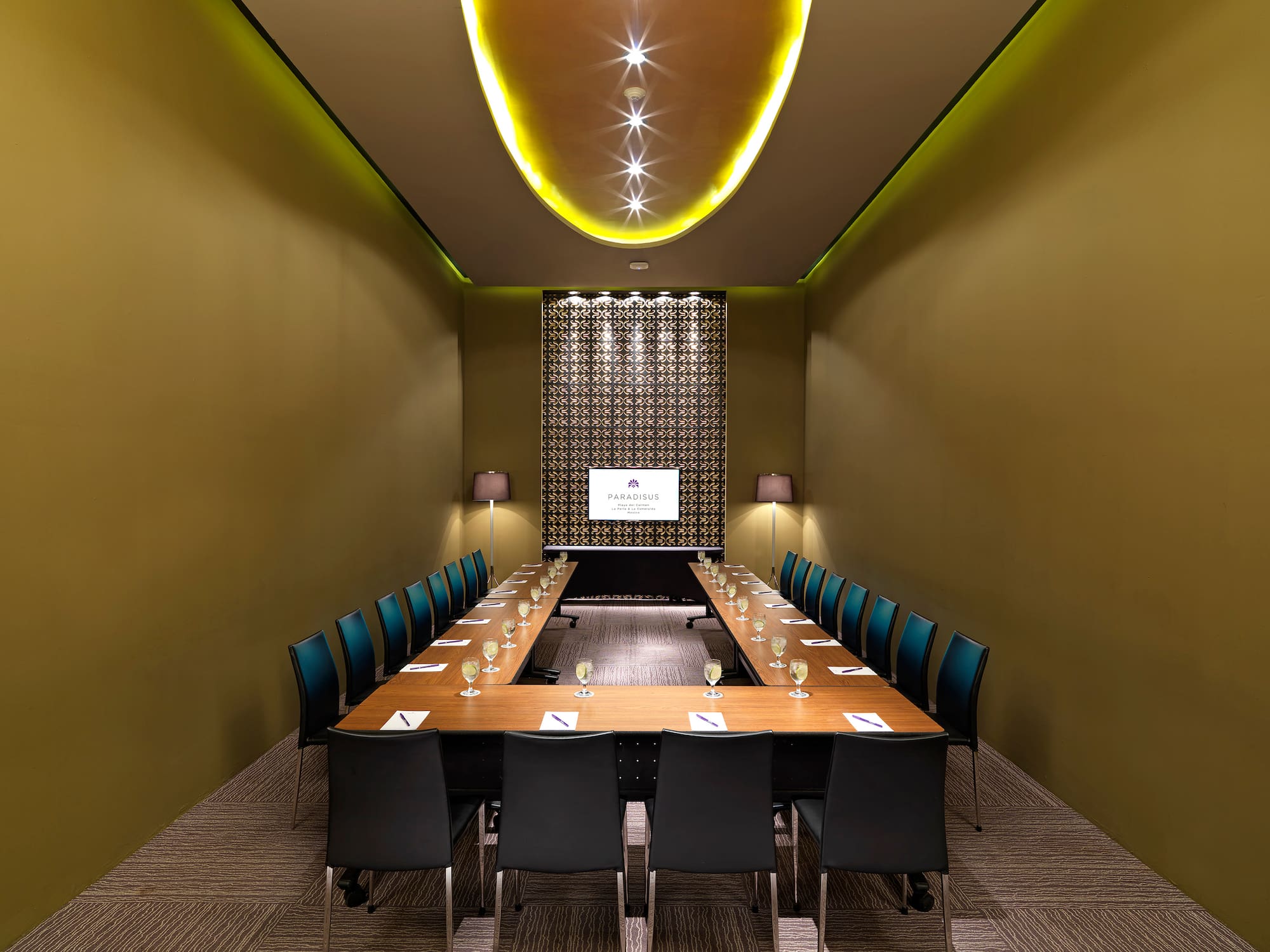 a room with a long table and chairs