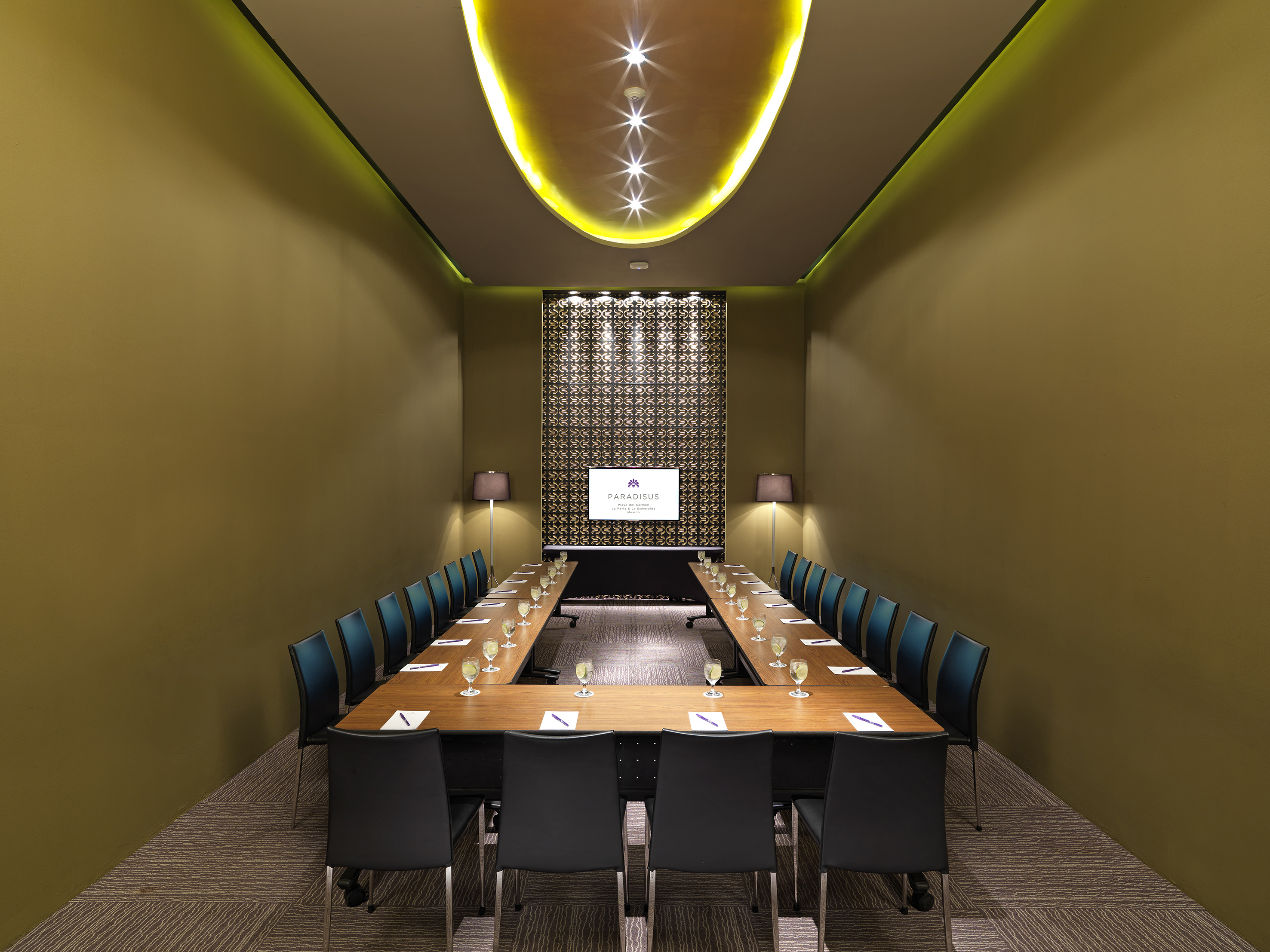 a room with a long table and chairs