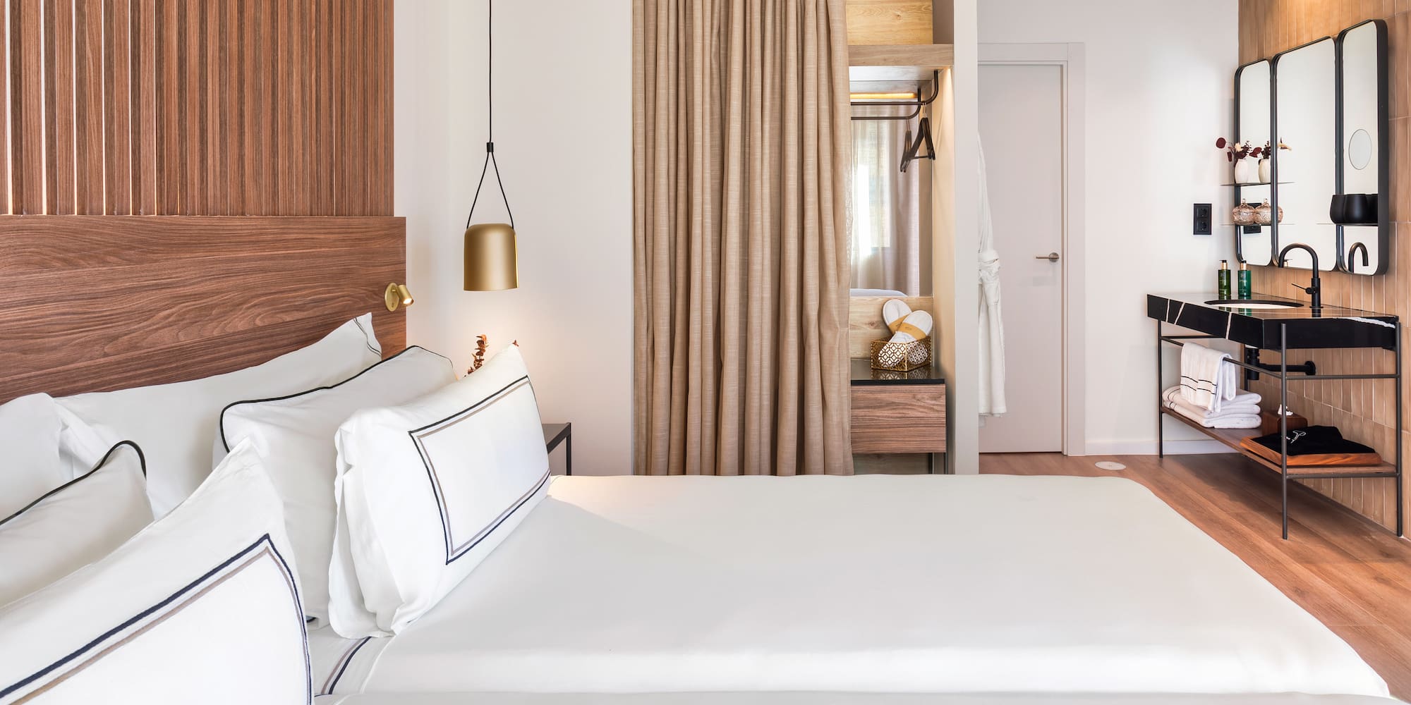 a room with two beds and a desk