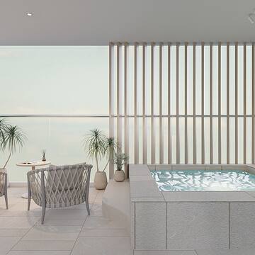 a room with a hot tub and chairs