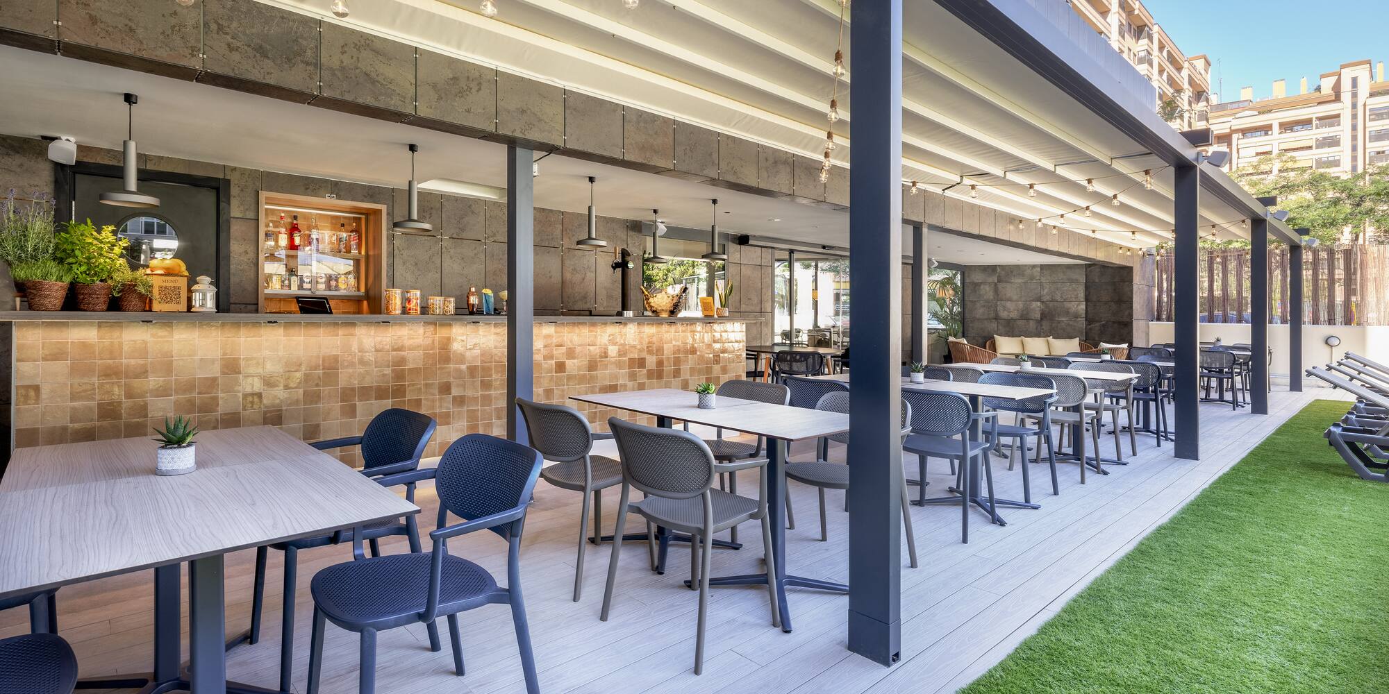 a patio with tables and chairs