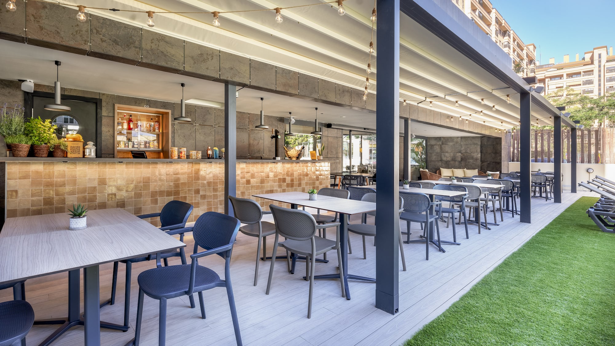 a patio with tables and chairs