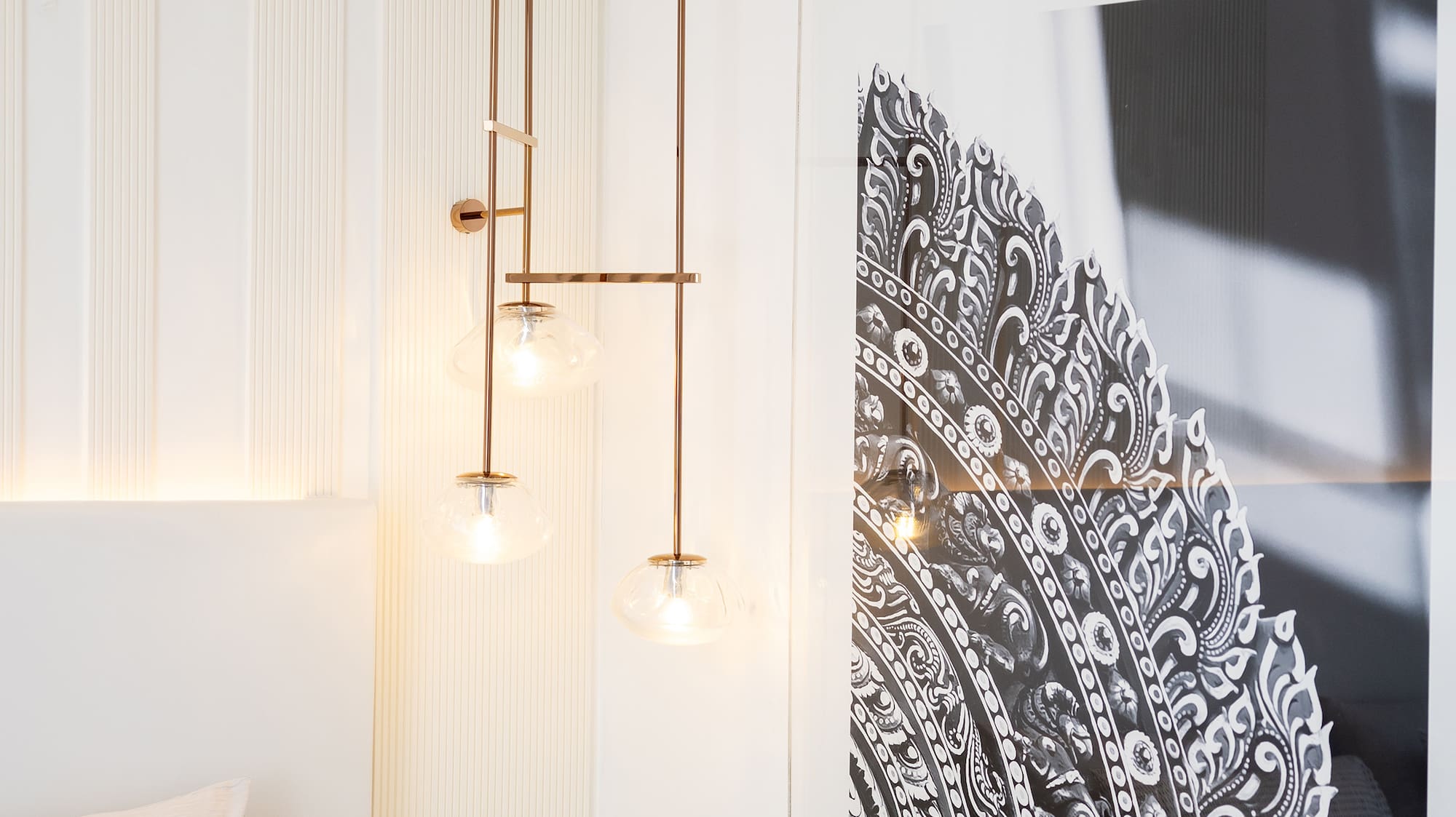 a bedroom with a picture from the ceiling