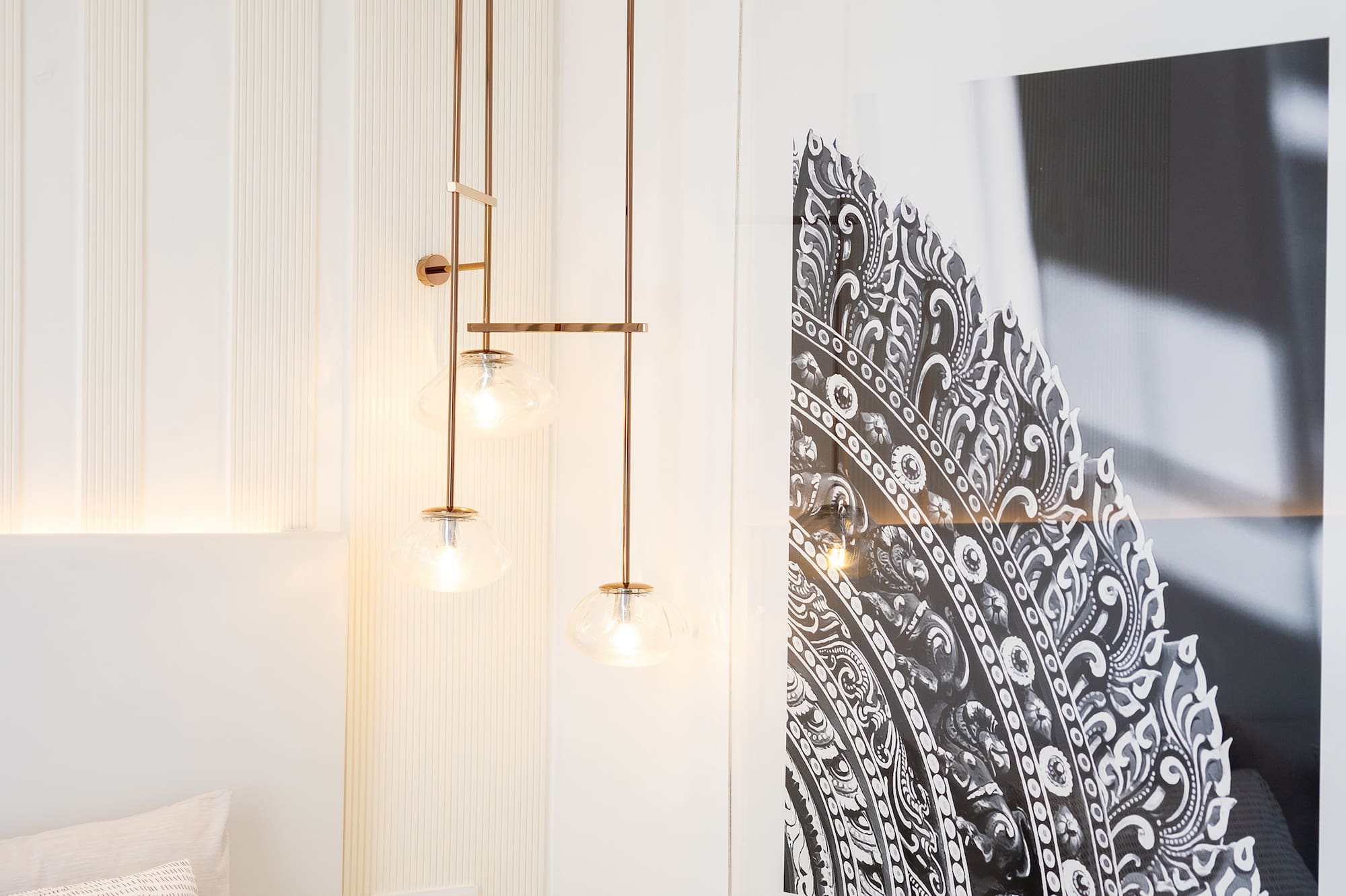 a bedroom with a picture from the ceiling