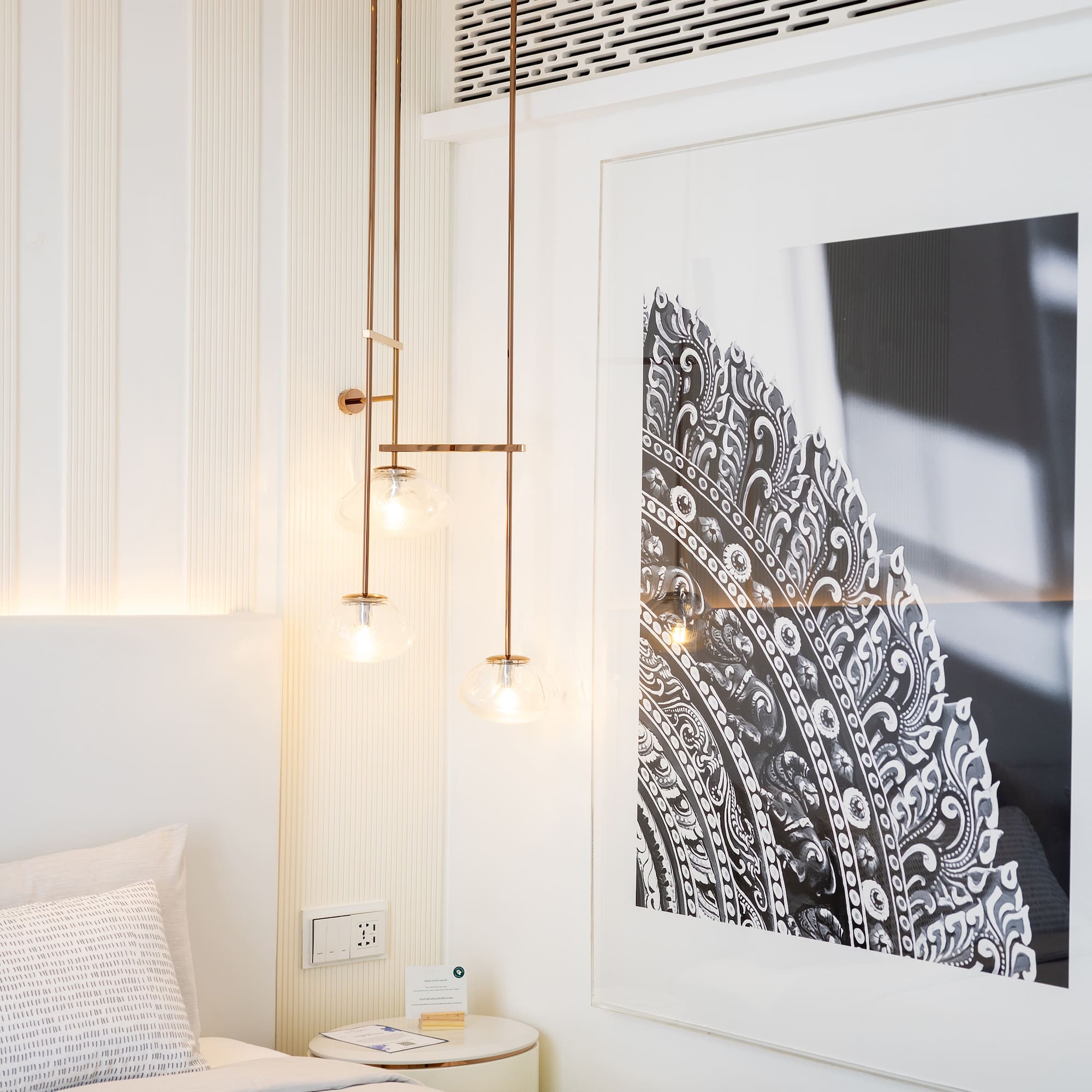 a bedroom with a picture from the ceiling