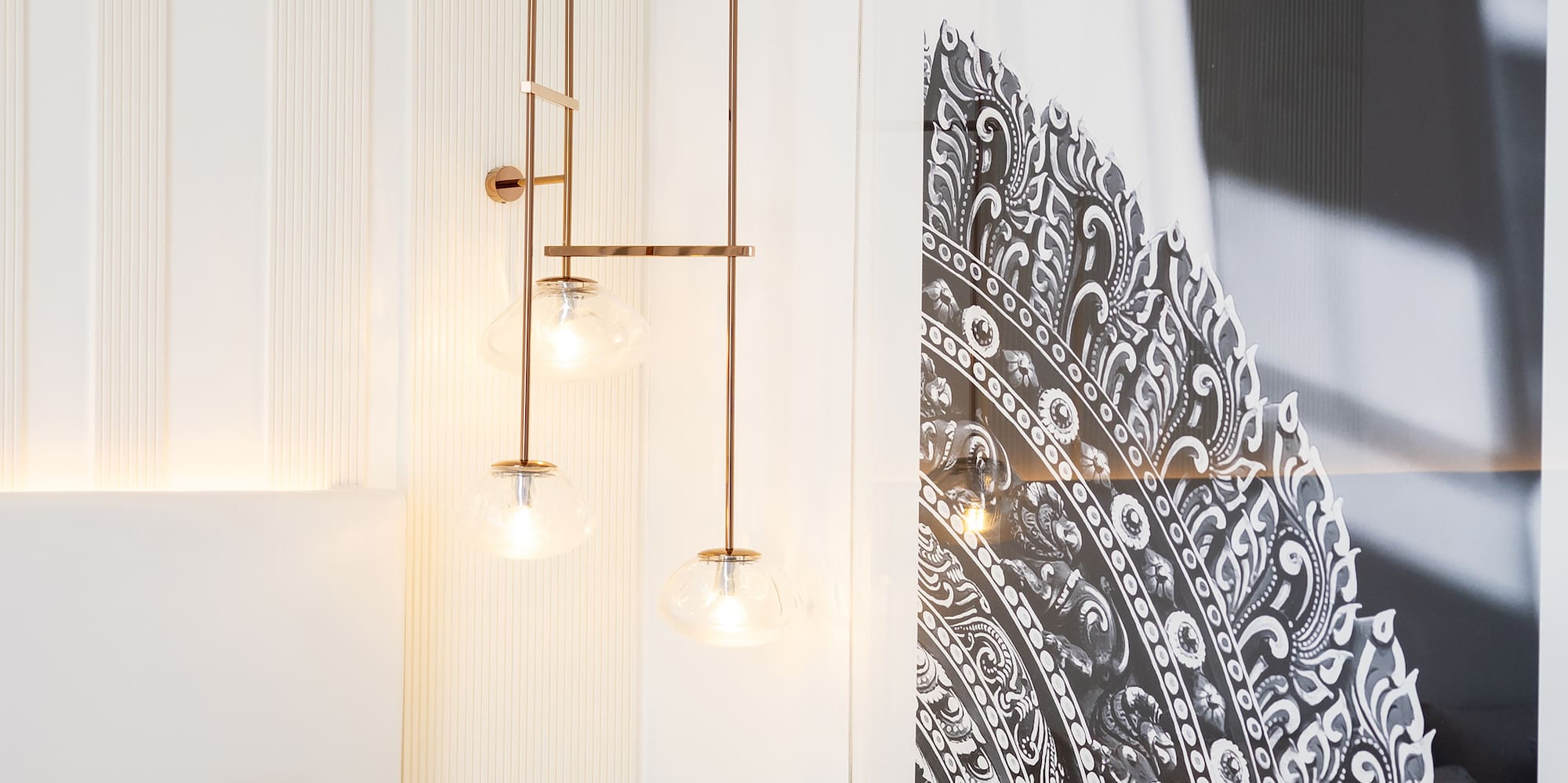 a bedroom with a picture from the ceiling