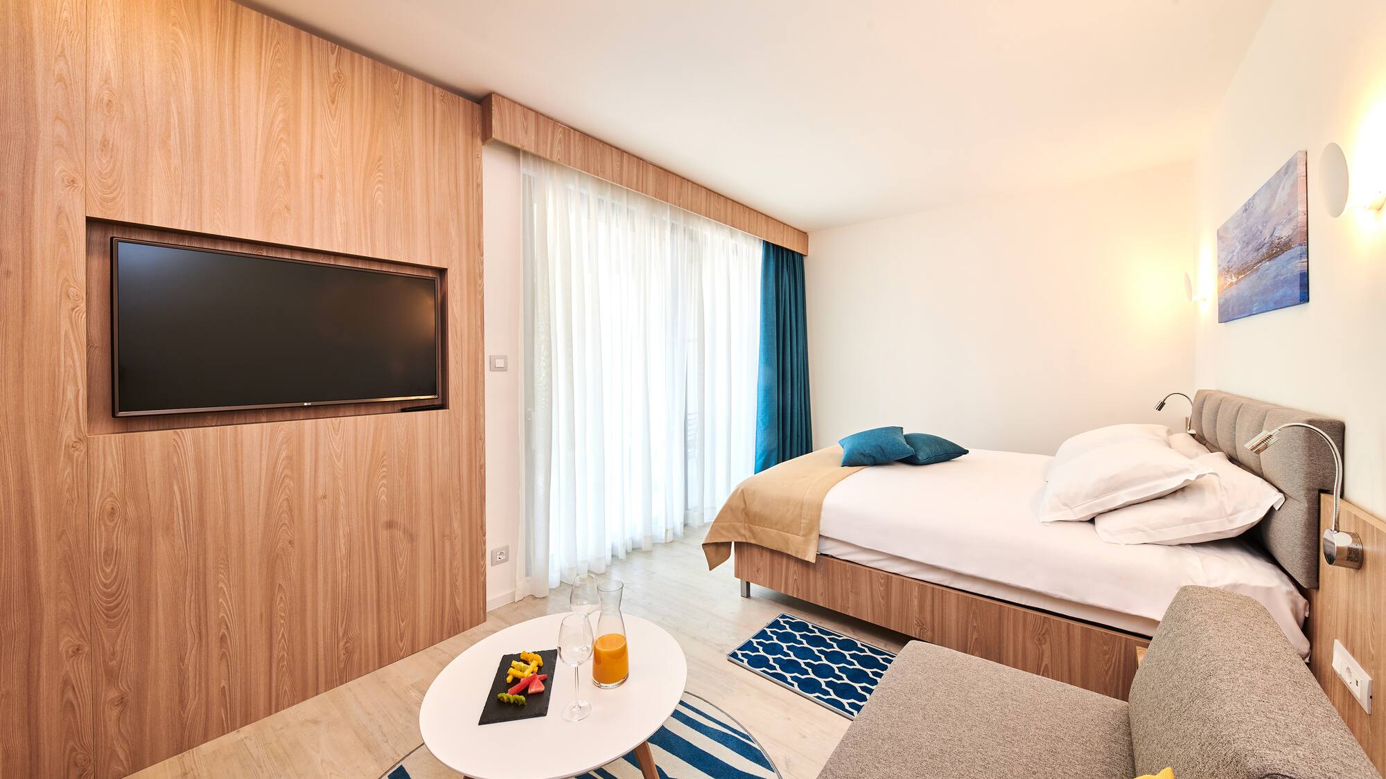 a room with a bed and a tv