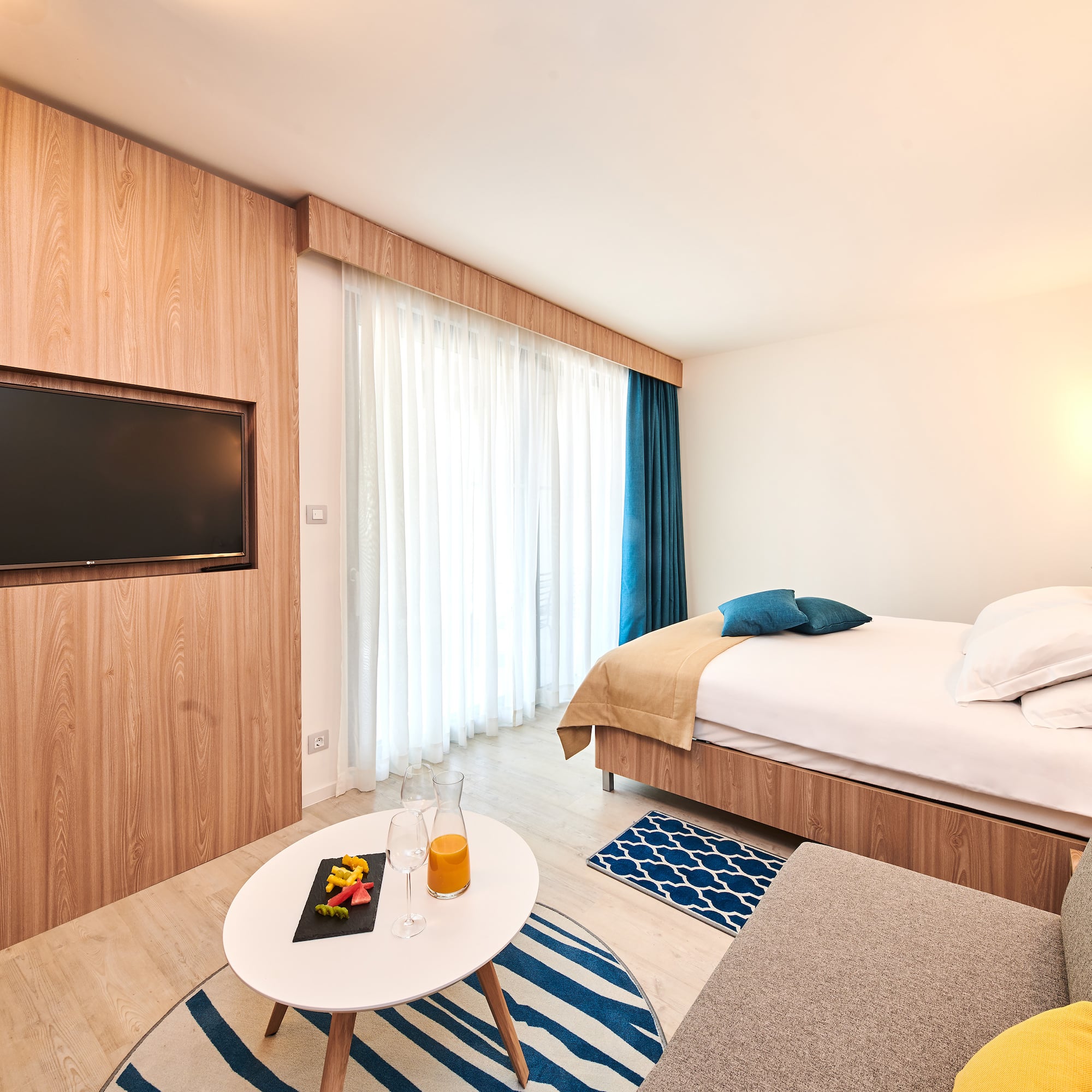 a room with a bed and a tv