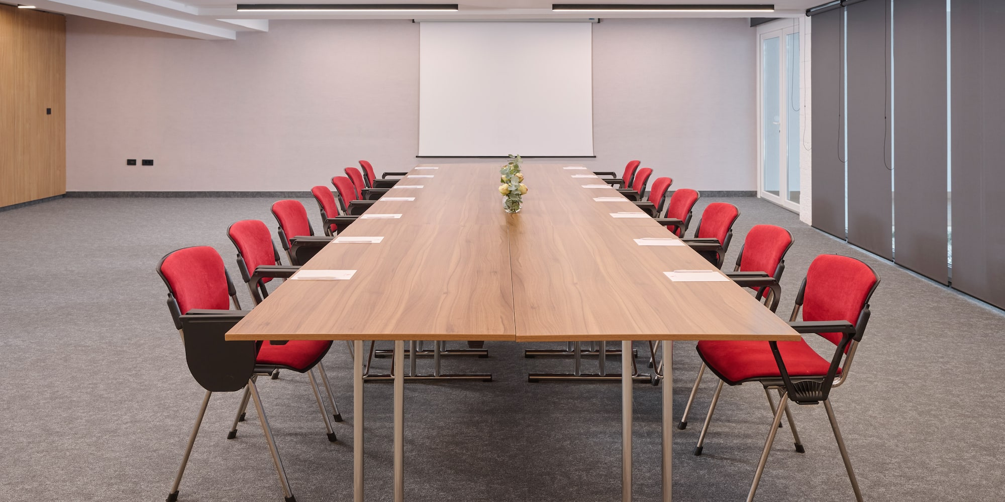 a conference room with a table and chairs