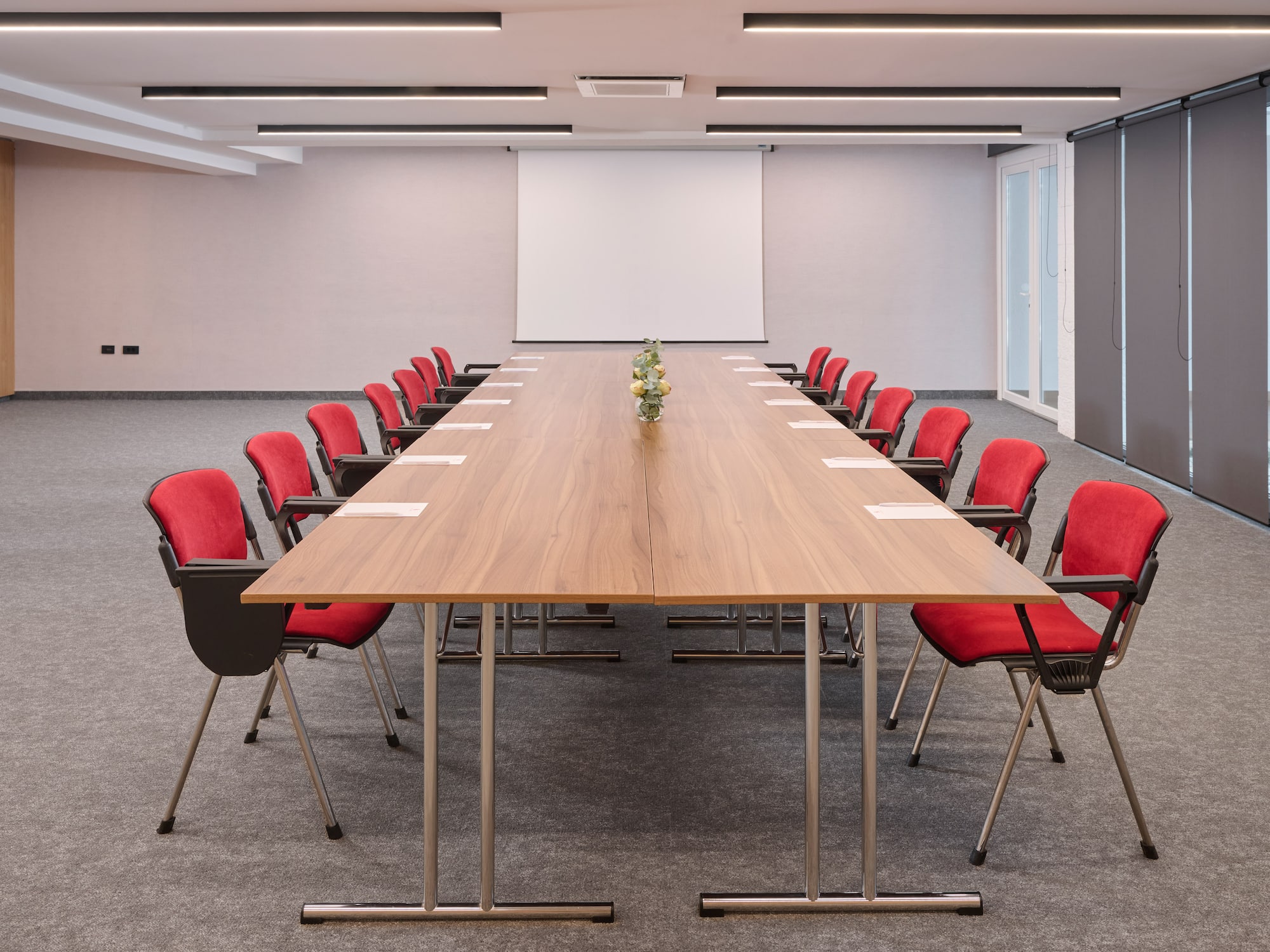 a conference room with a table and chairs