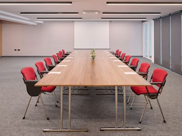 a conference room with a table and chairs