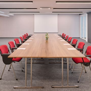 a conference room with a table and chairs